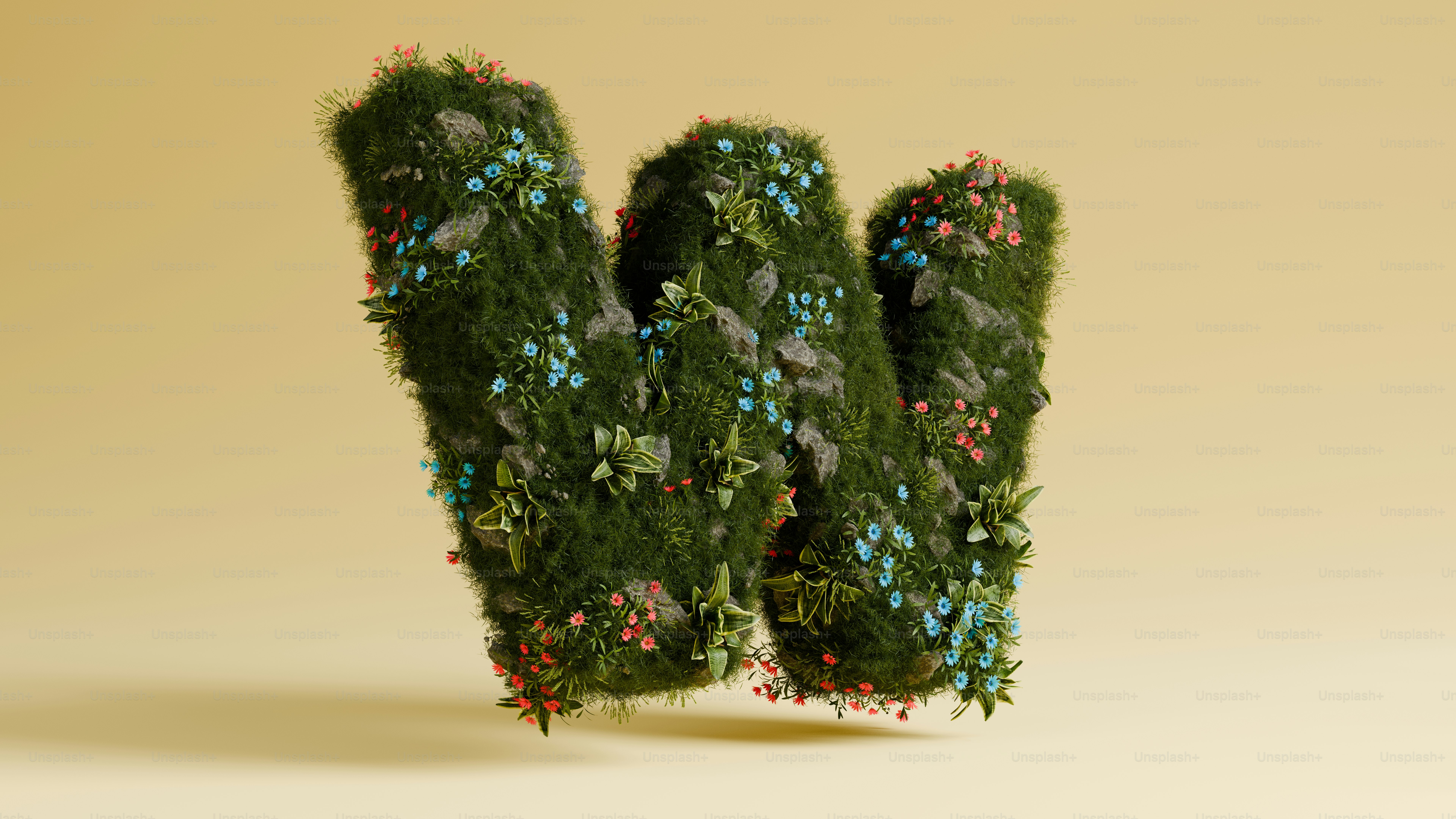 植物で飾られた青々とした緑色の文字「w」。