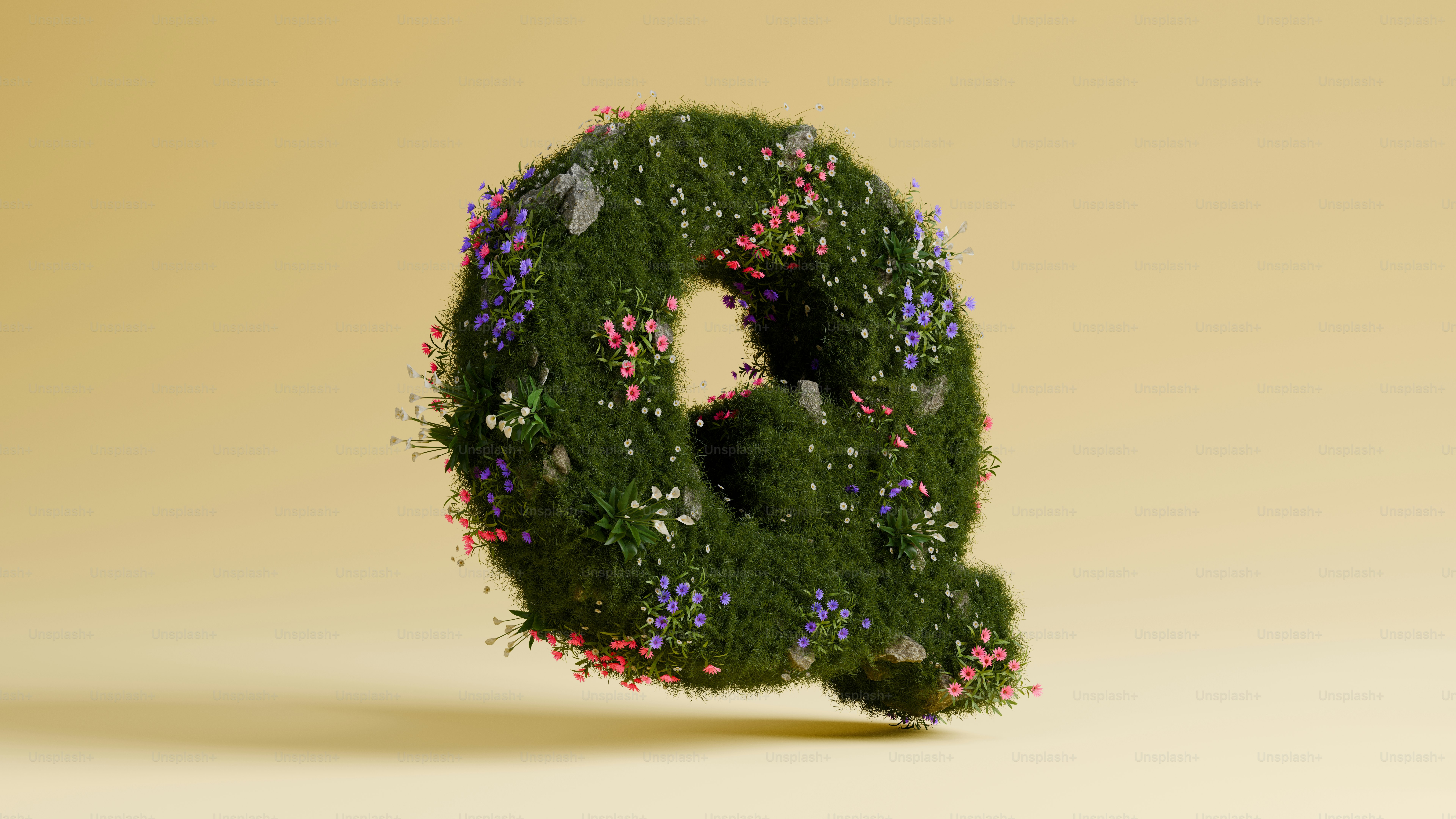 The letter "q" is covered in plants and flowers.