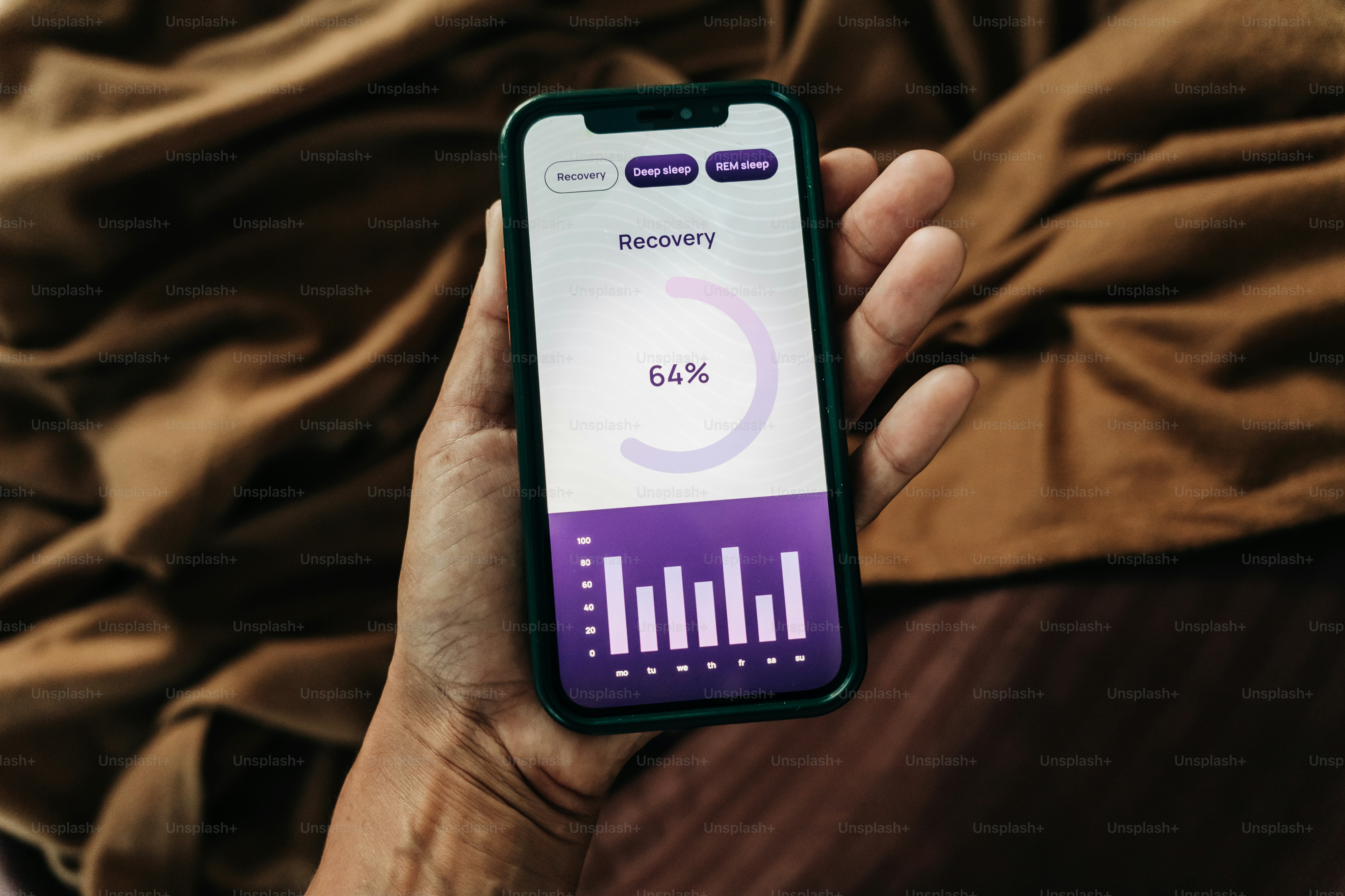 A hand holds a phone displaying a recovery screen.