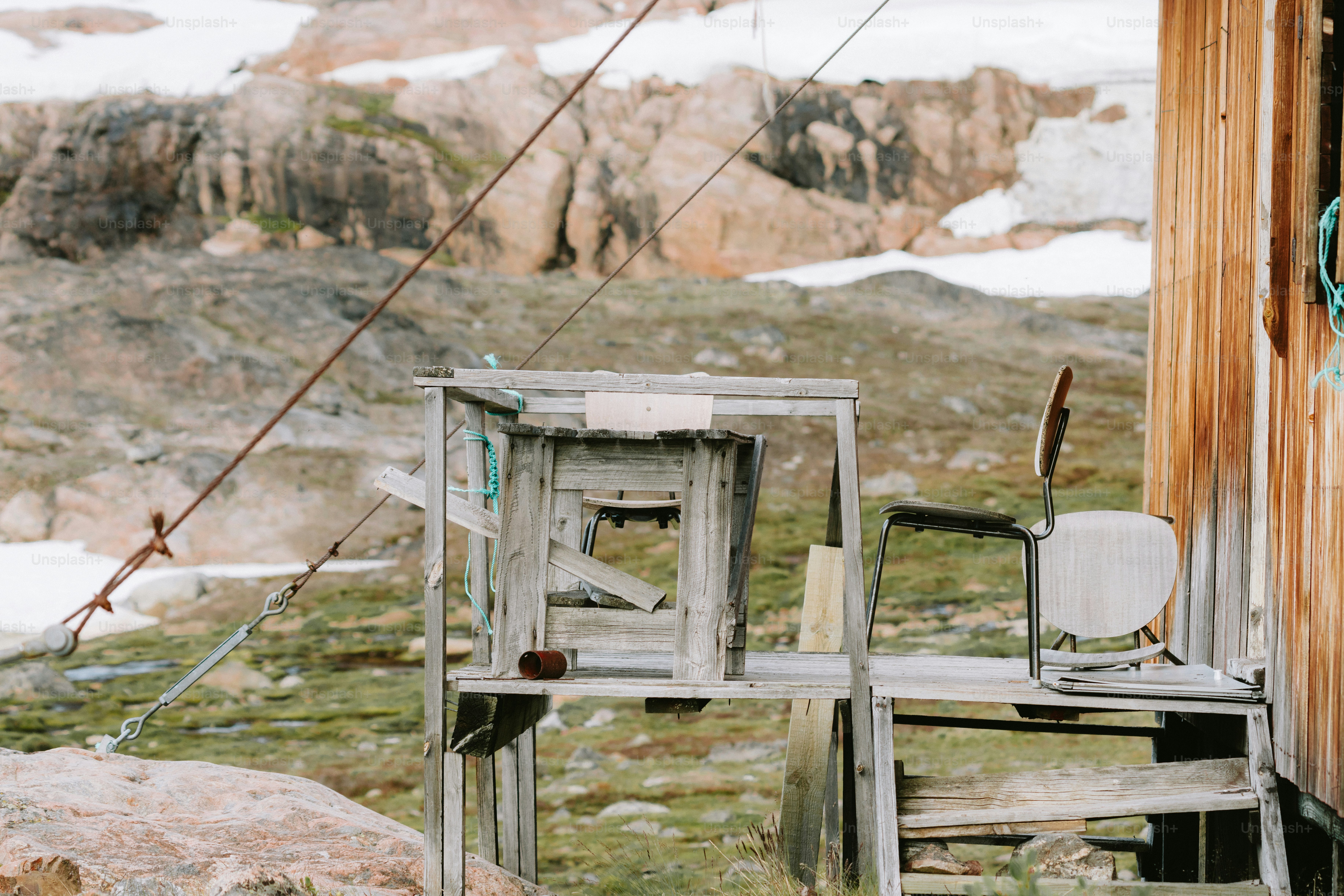An outdoor set up with a wooden ladder and chair.