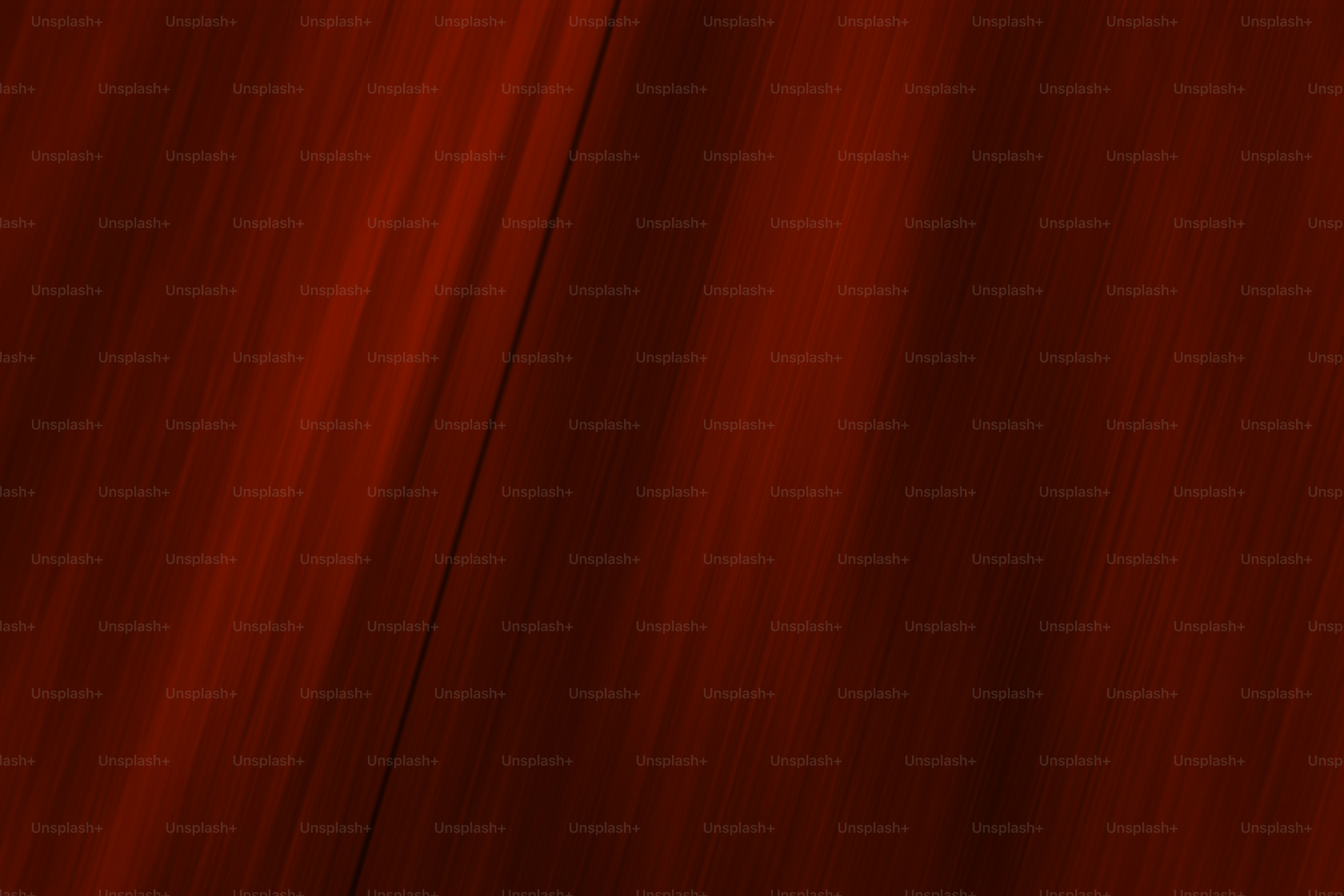 Red abstract background with angled light streaks.