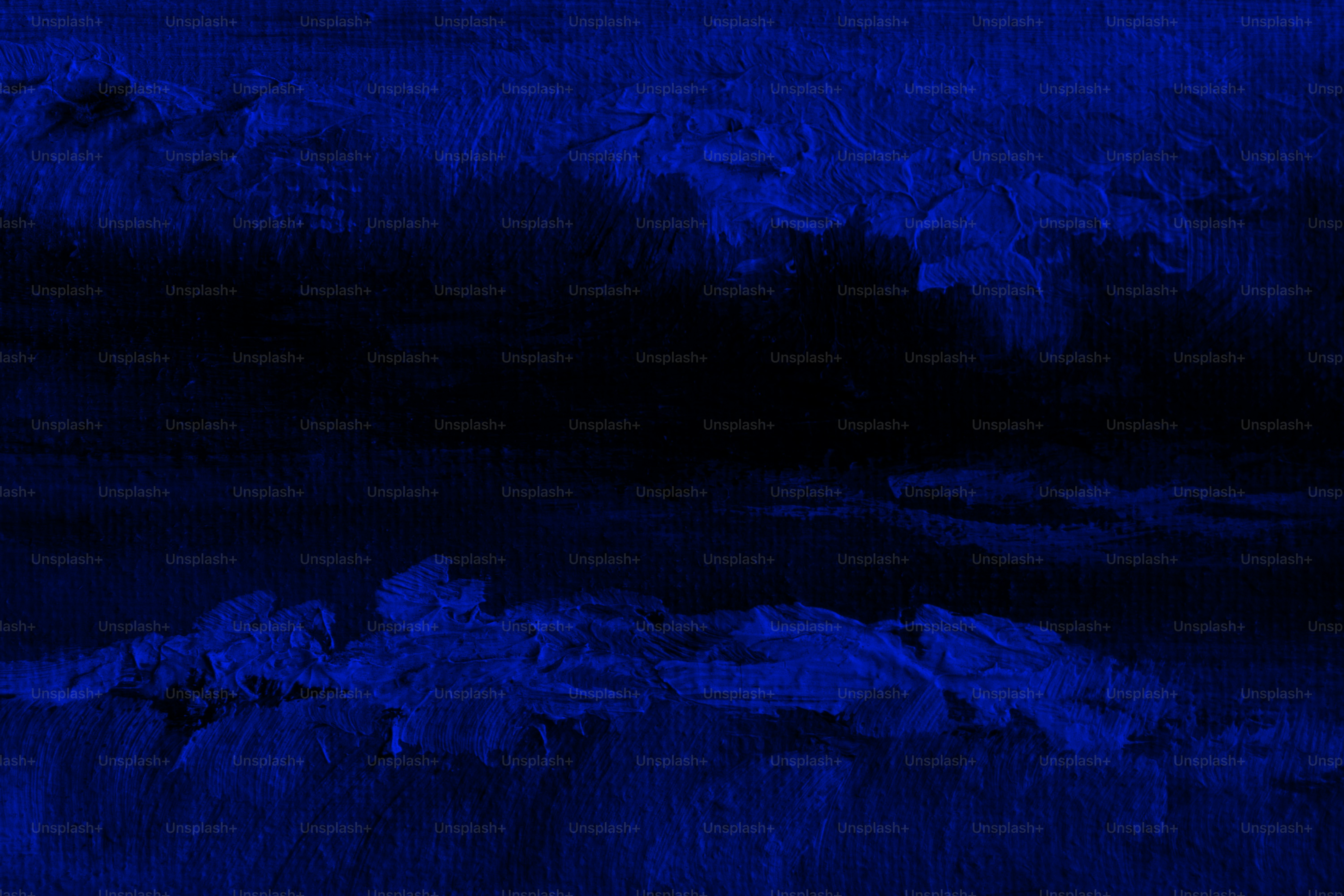 Dark blue landscape with a vast black space.