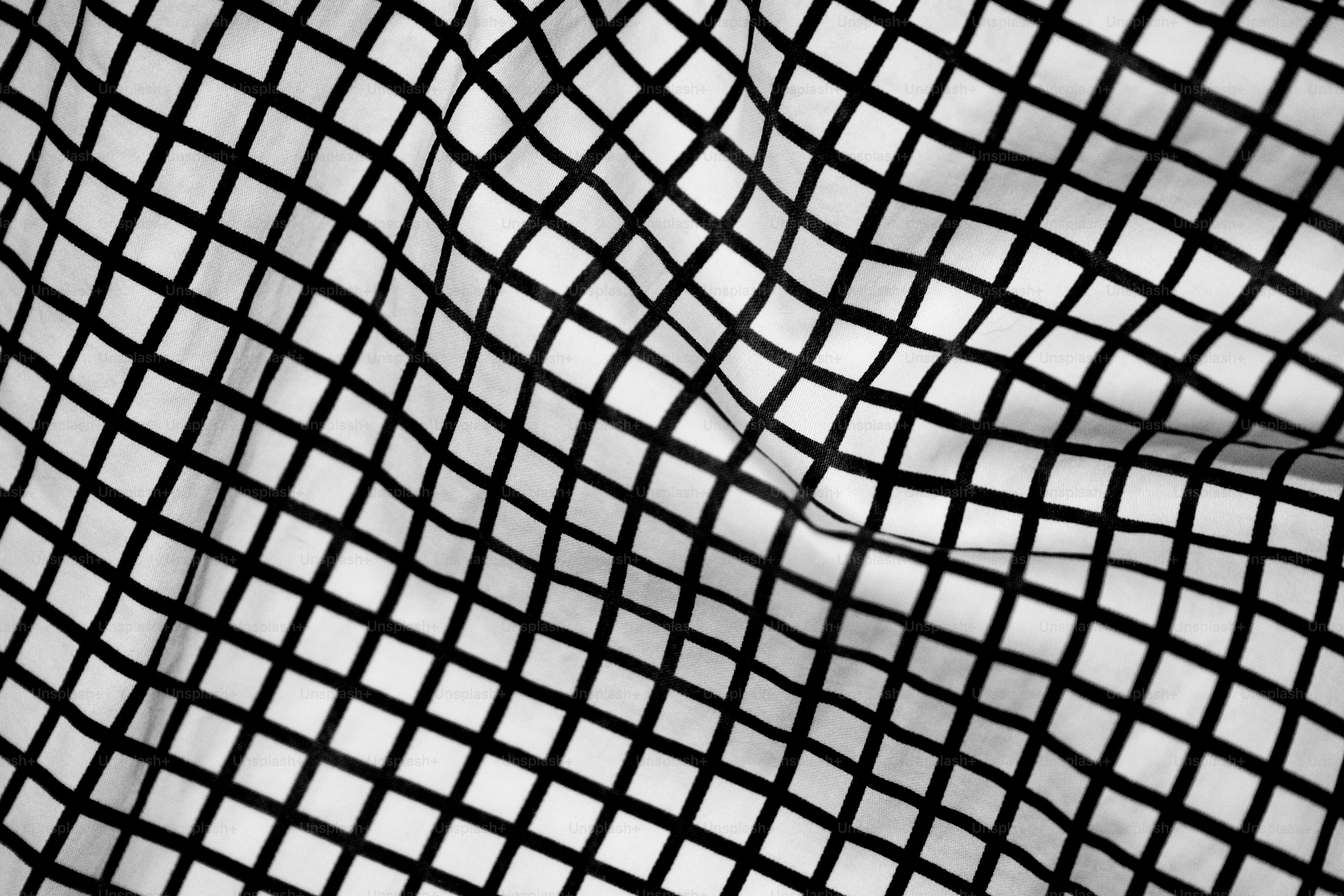A gridded fabric creates lines and patterns.