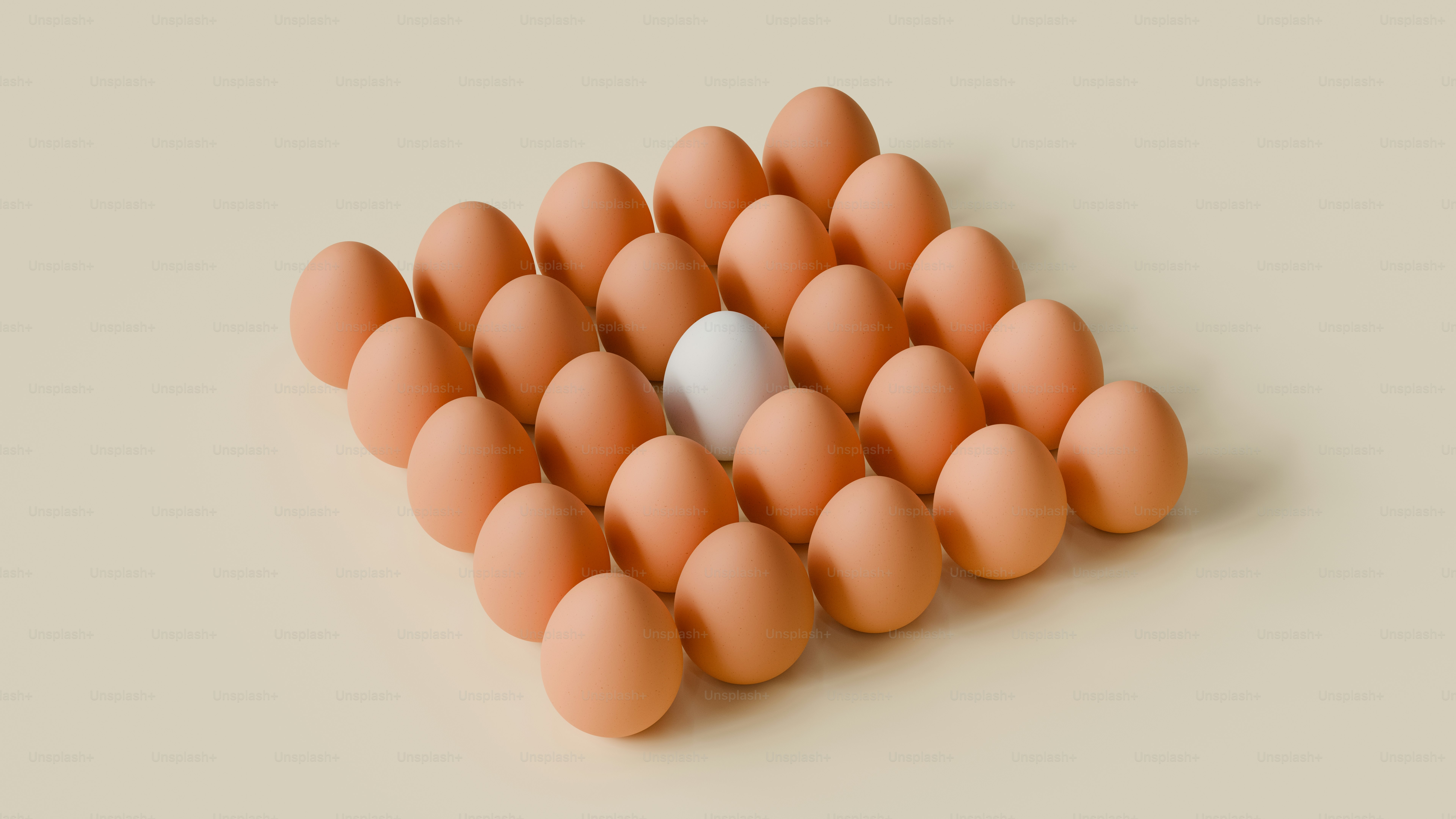 A white egg stands out in a brown egg group.