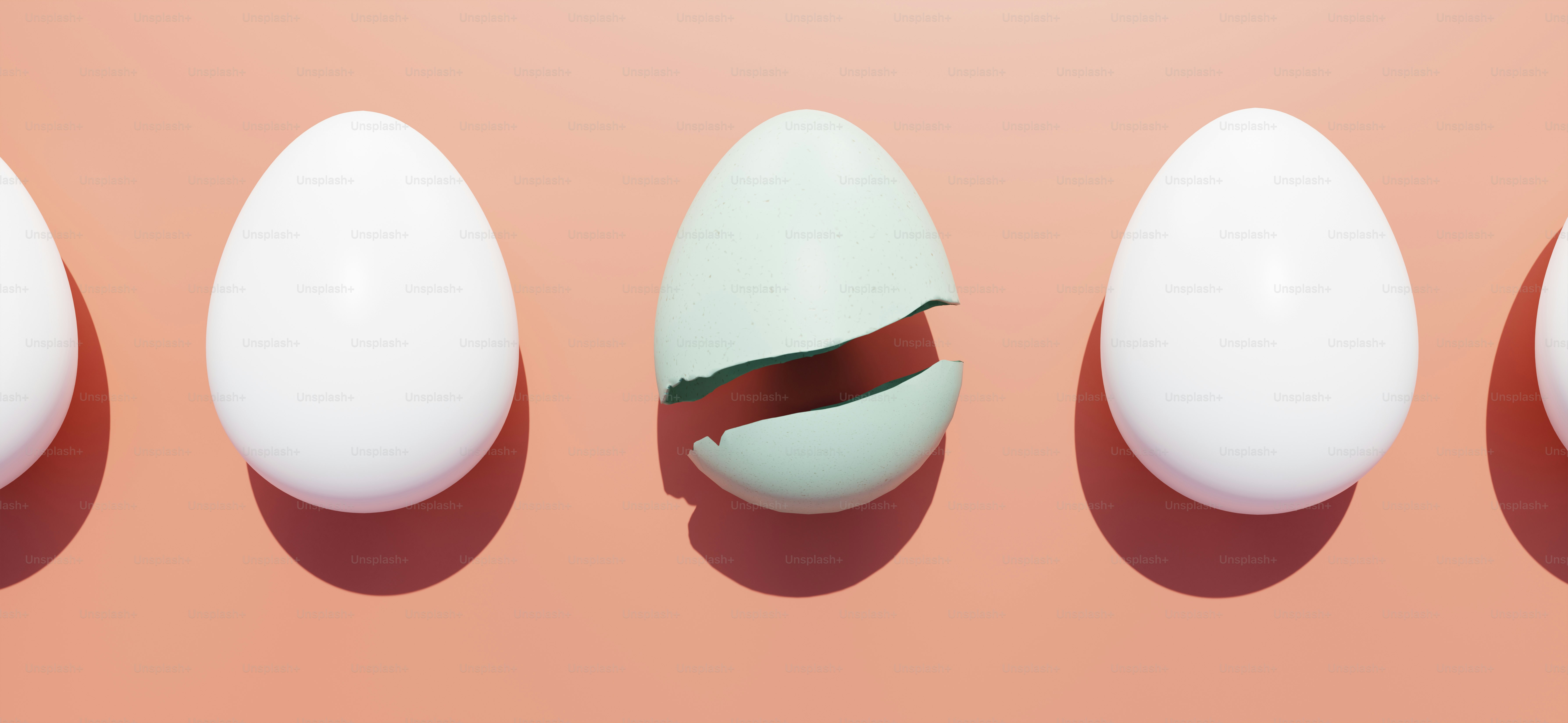 A cracked egg stands out from the uncracked ones.