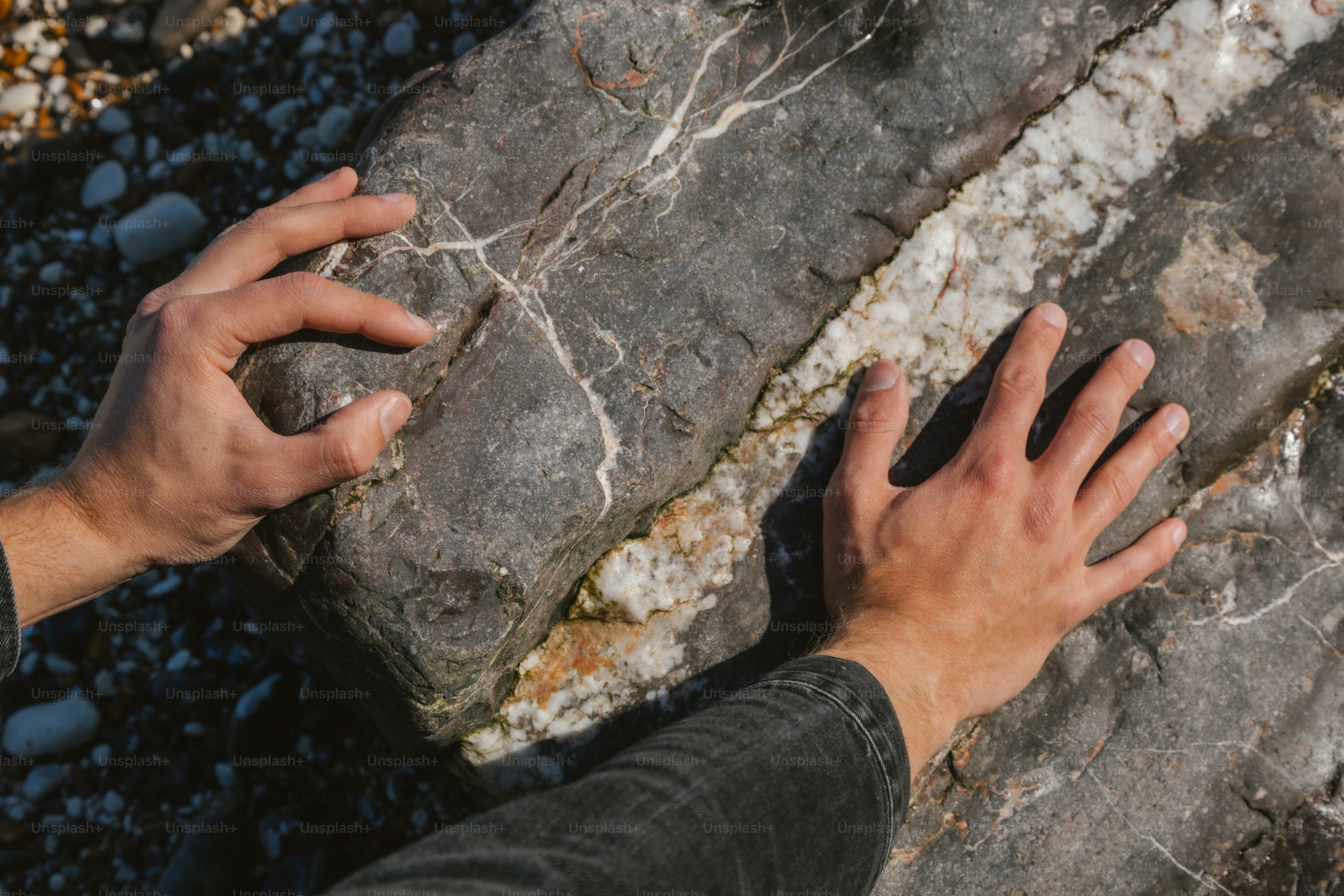 Hands resting on a rough, textured surface. photo – Texture Image on ...