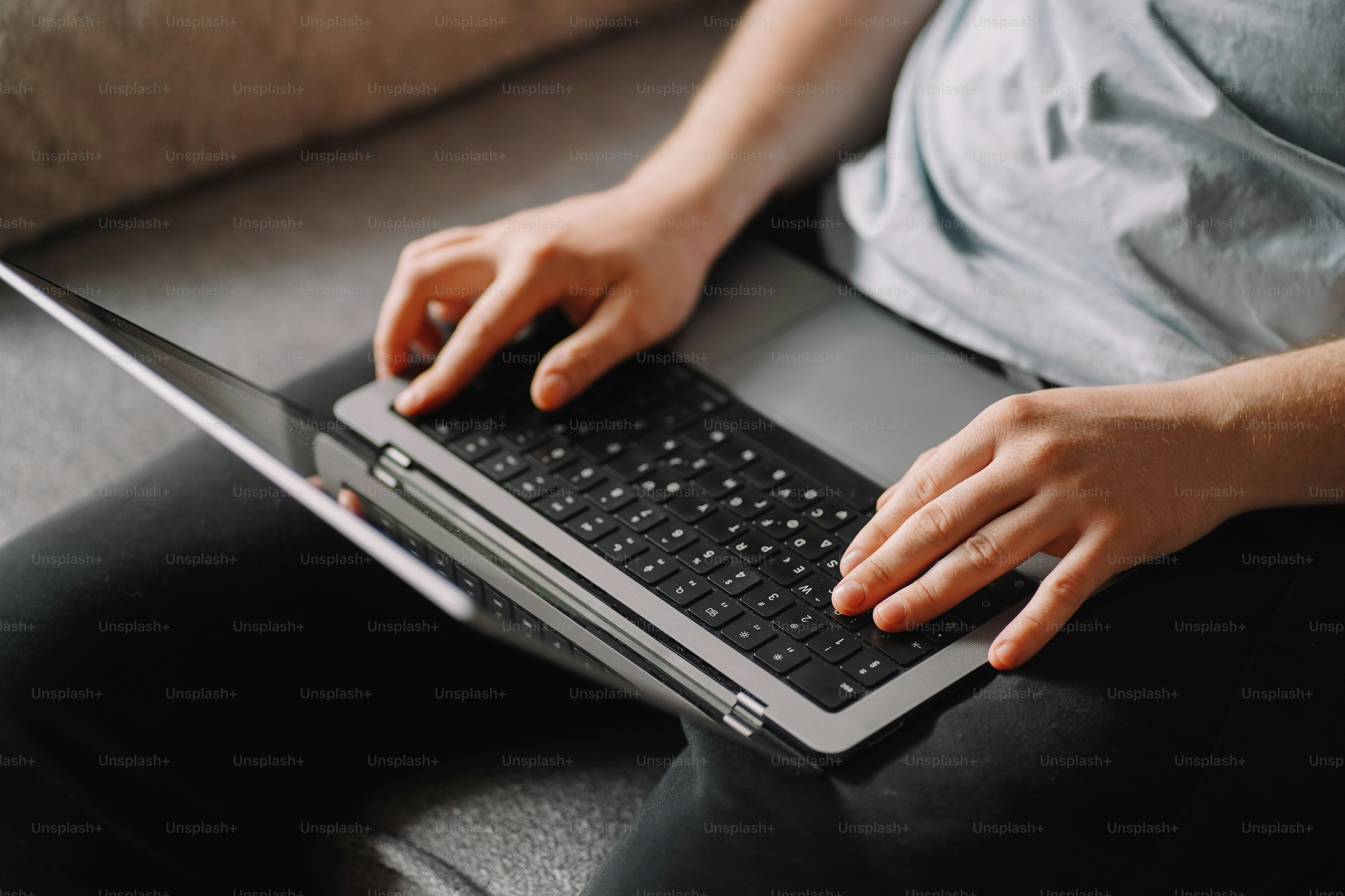 Someone is typing on their laptop.