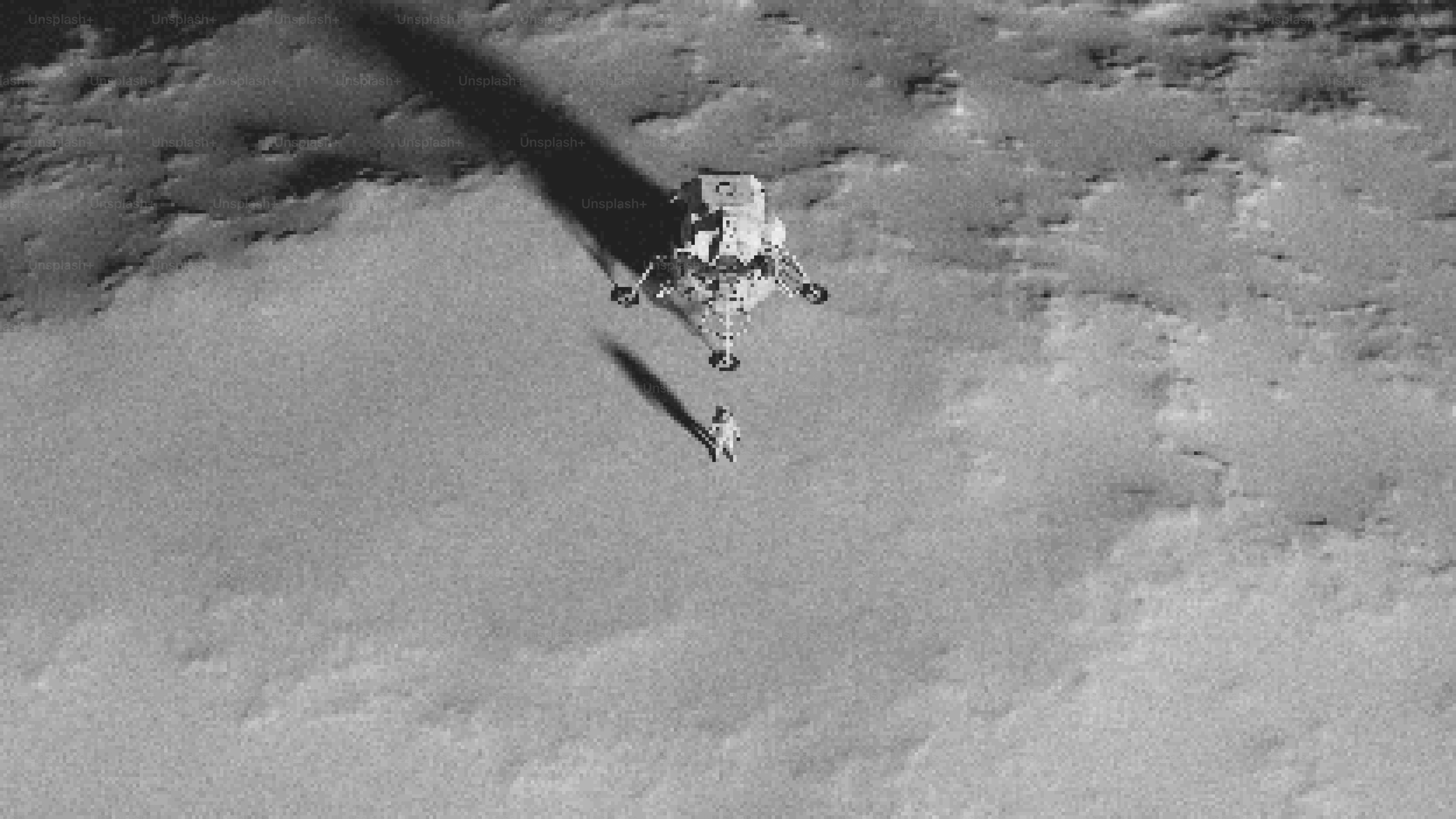 Astronaut walks near a lunar module.