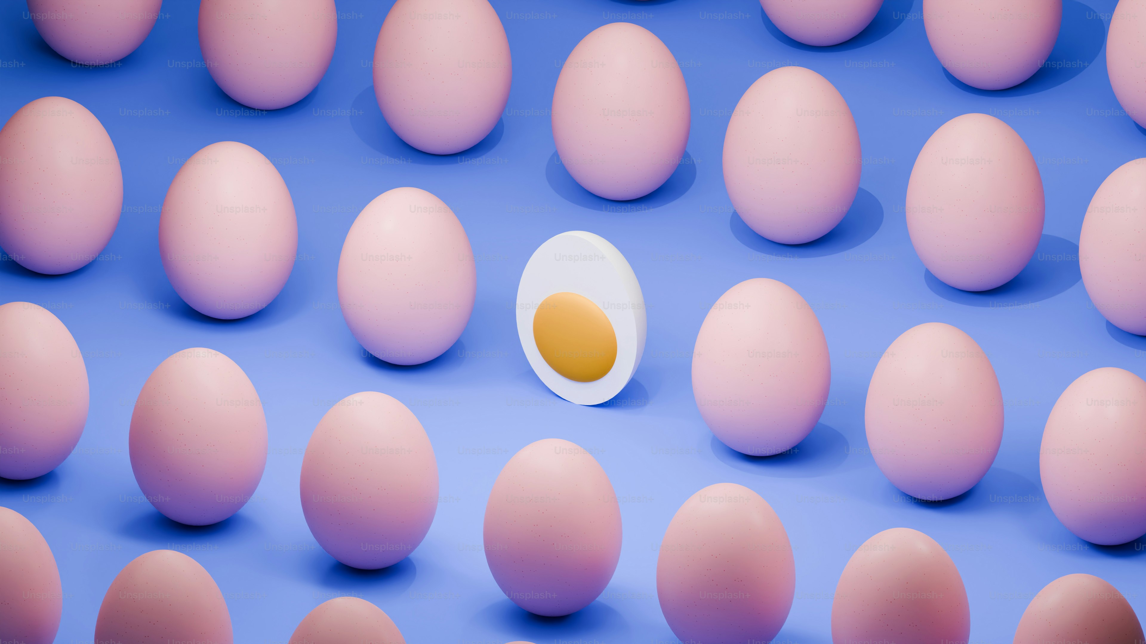 An egg cut open among many whole eggs.
