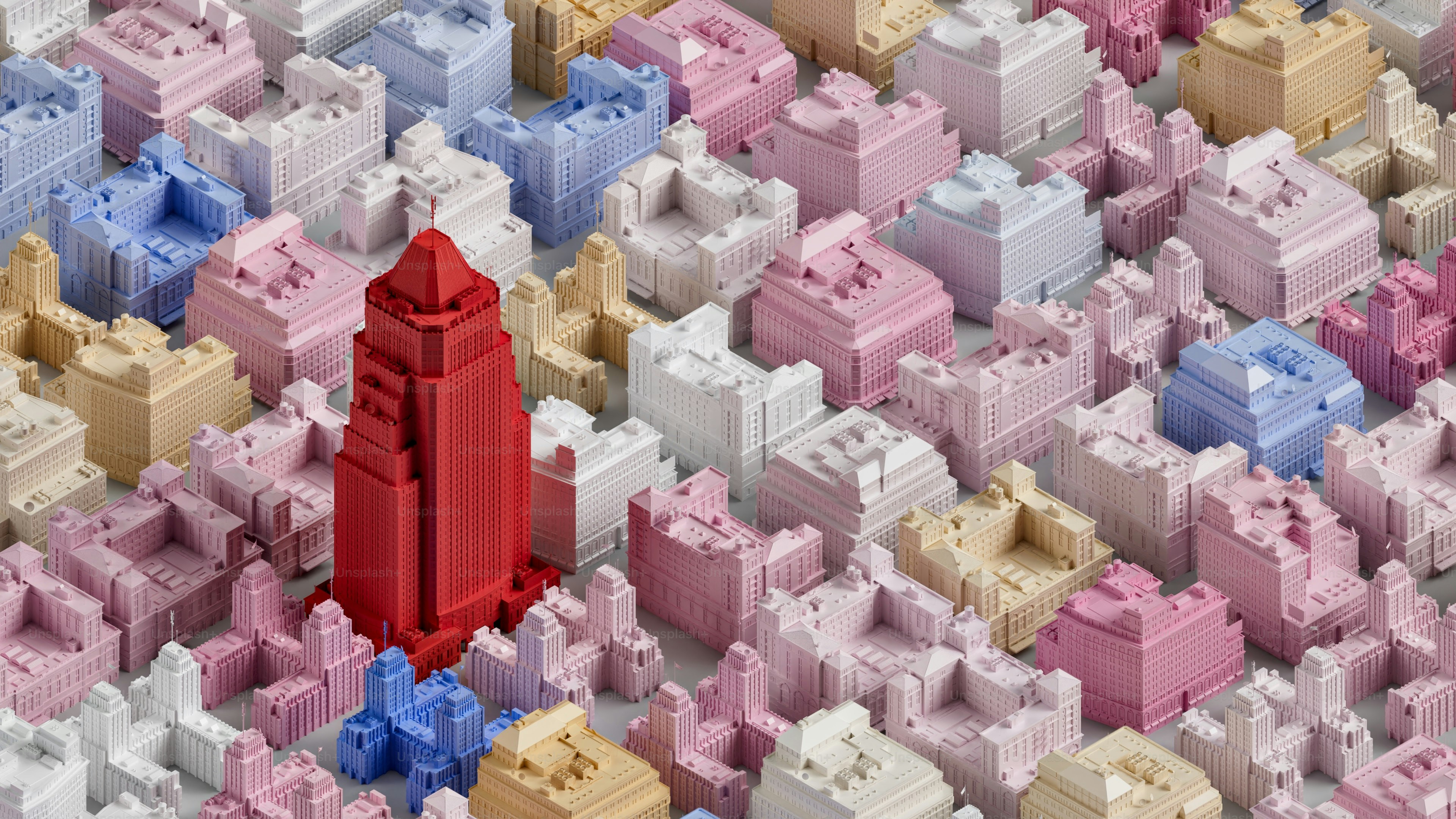 A red tower stands out amongst pastel buildings.