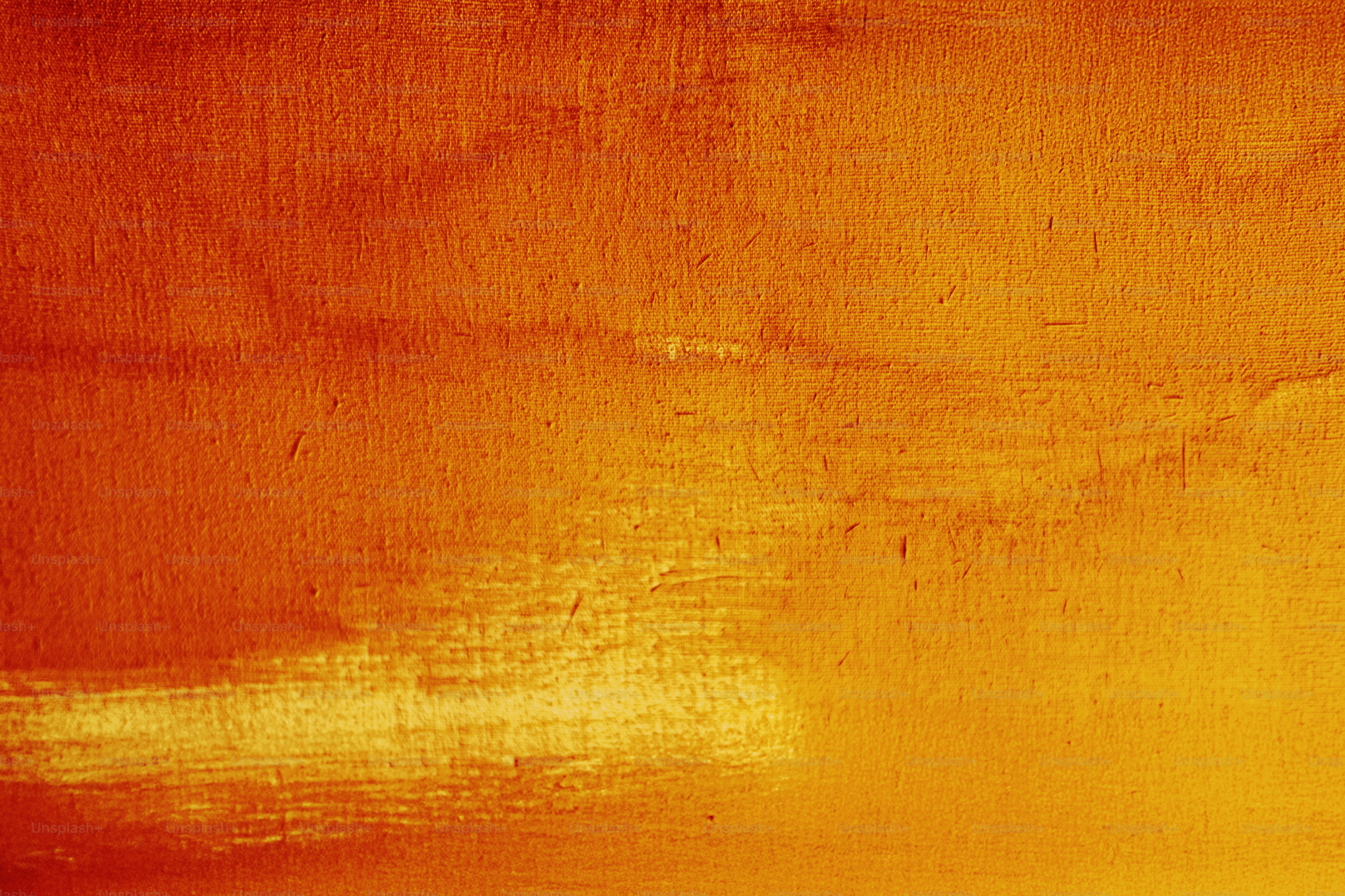 Uma obra de arte abstrata pintada em tons de laranja quente.
