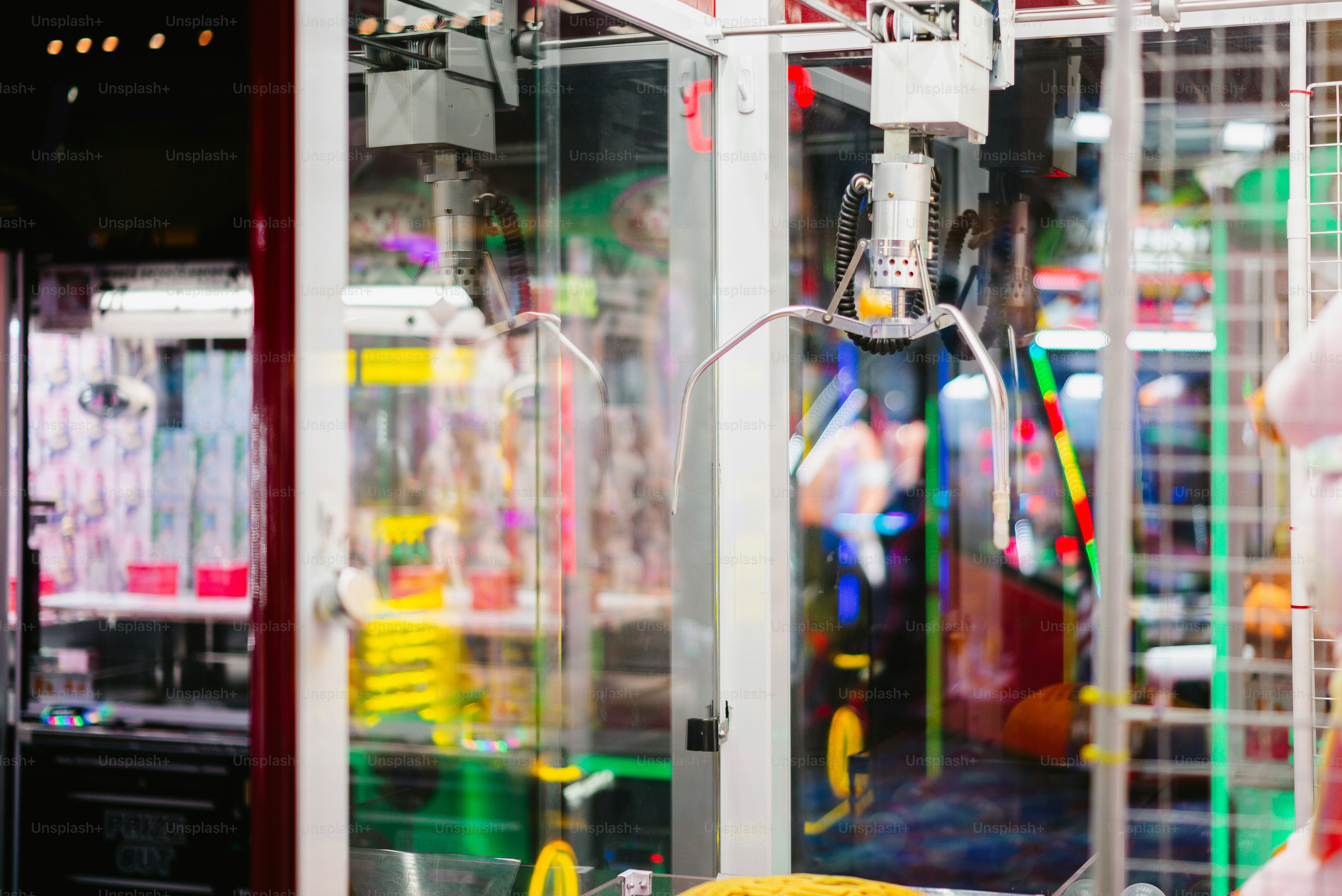 A claw machine is ready to grab a prize.