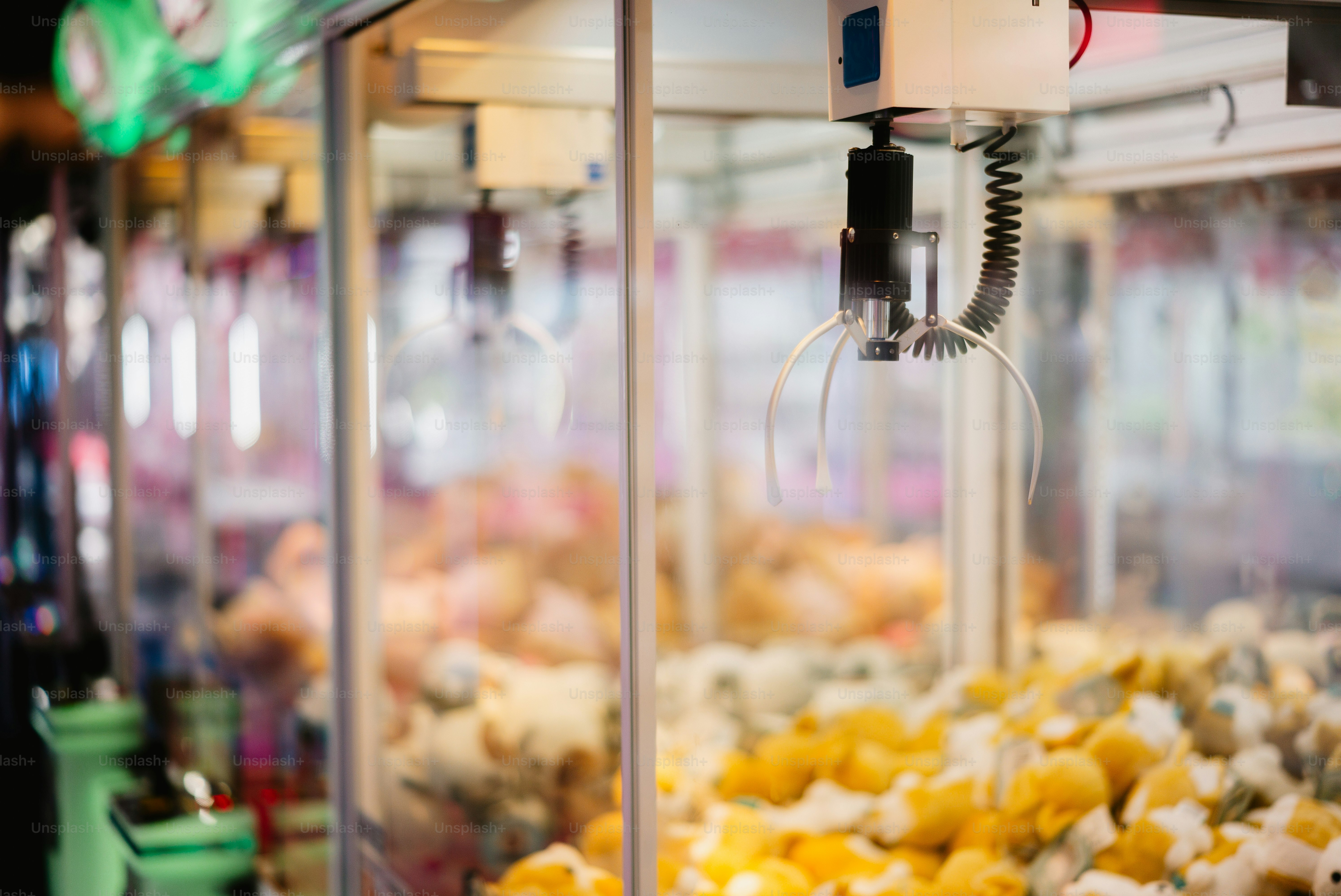 A claw machine filled with prizes.