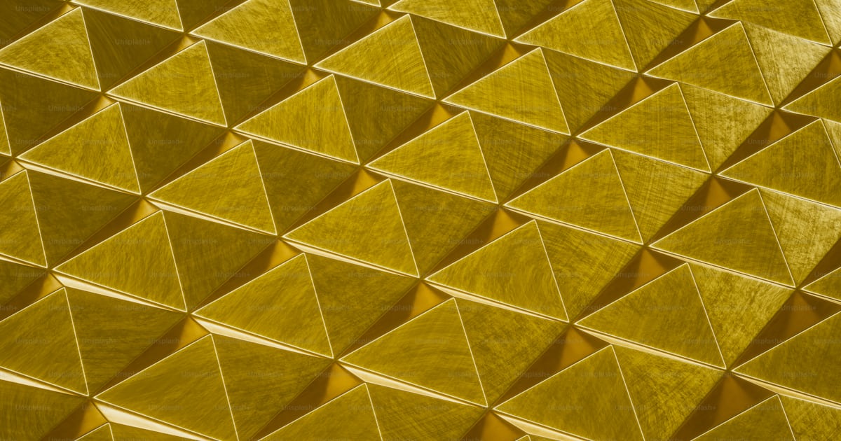Golden pyramid structures form a repeating pattern. photo – Wallpaper ...