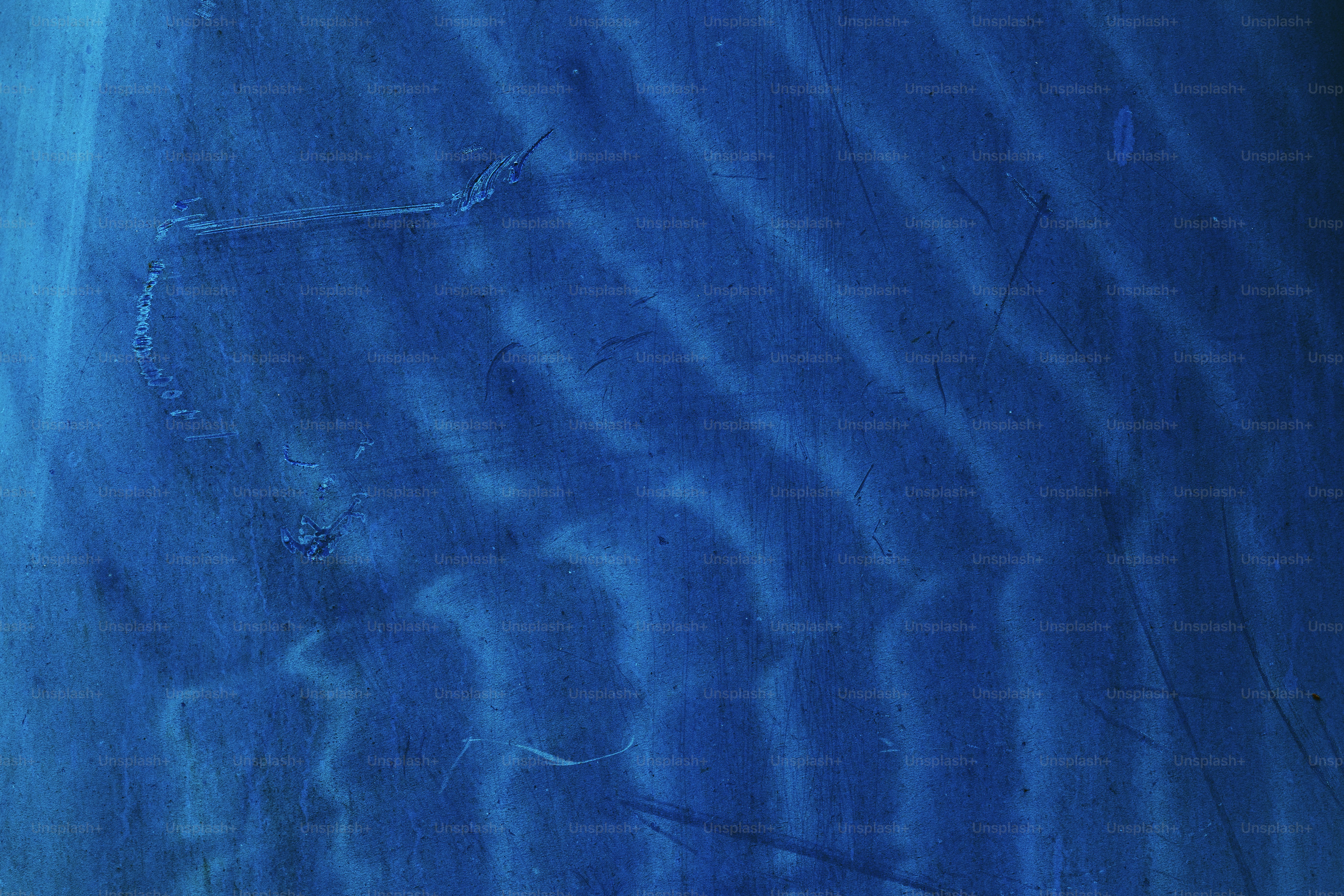 Blue waves appear across a surface.