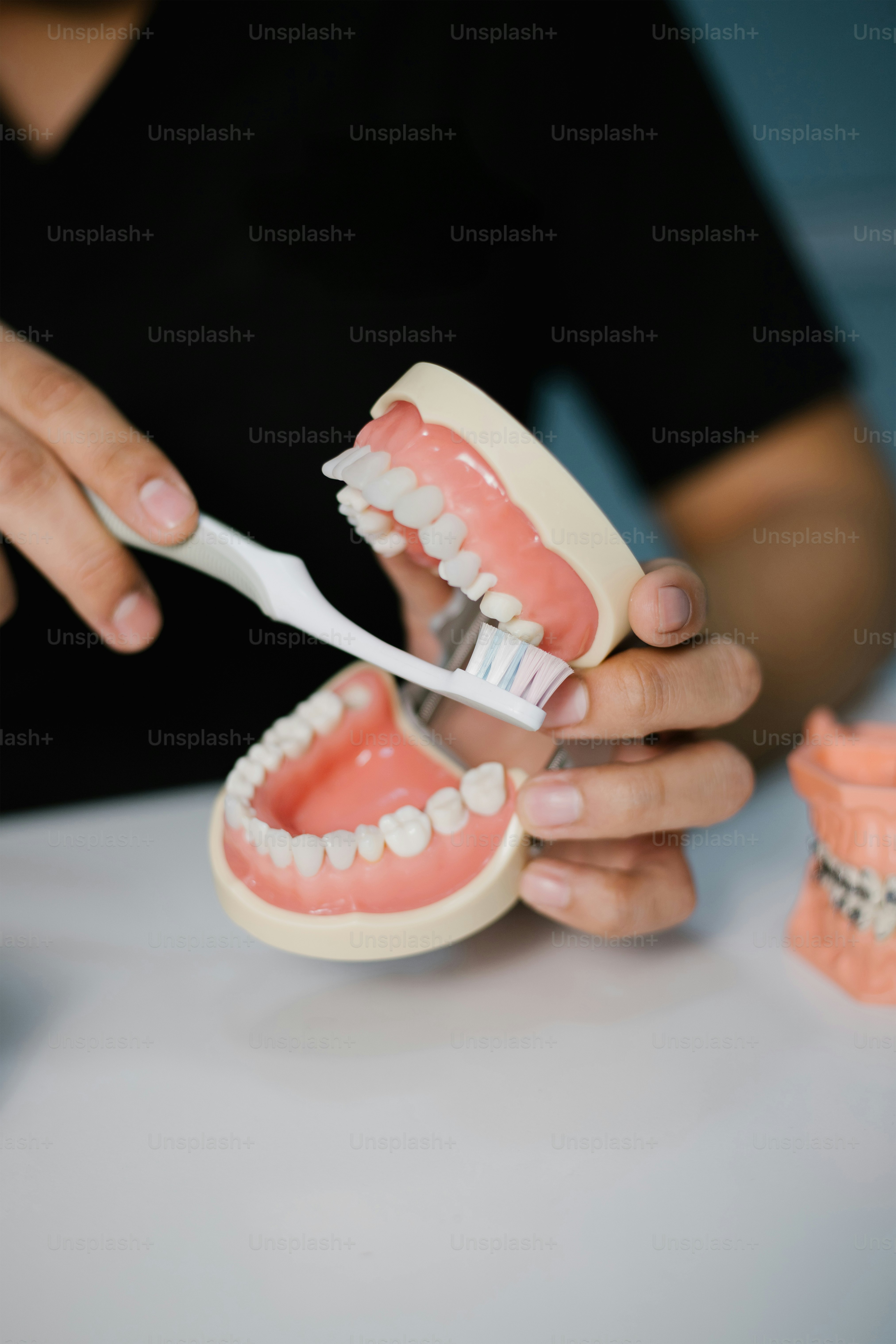 Someone is demonstrating how to brush teeth.