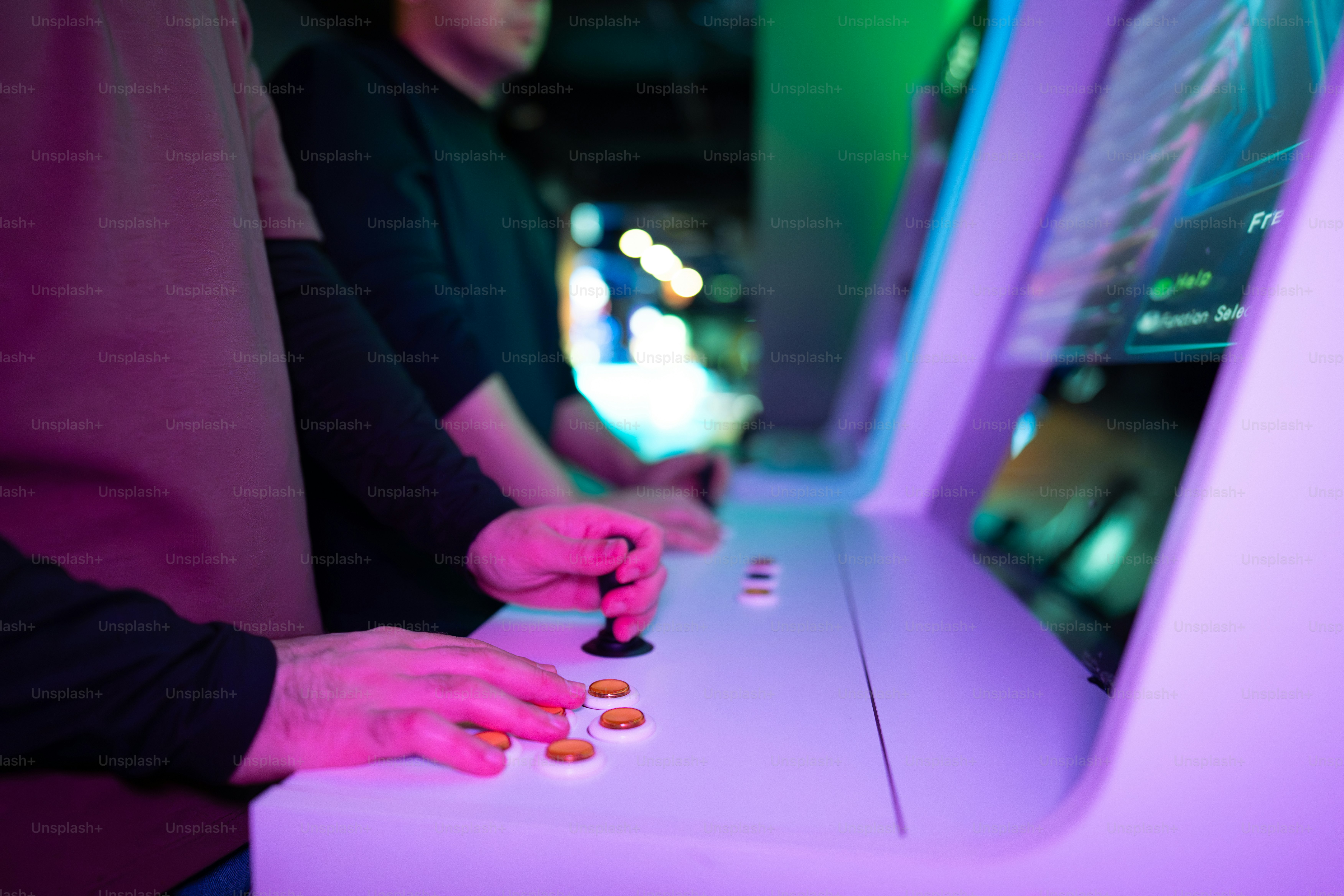 People play video games in an arcade.