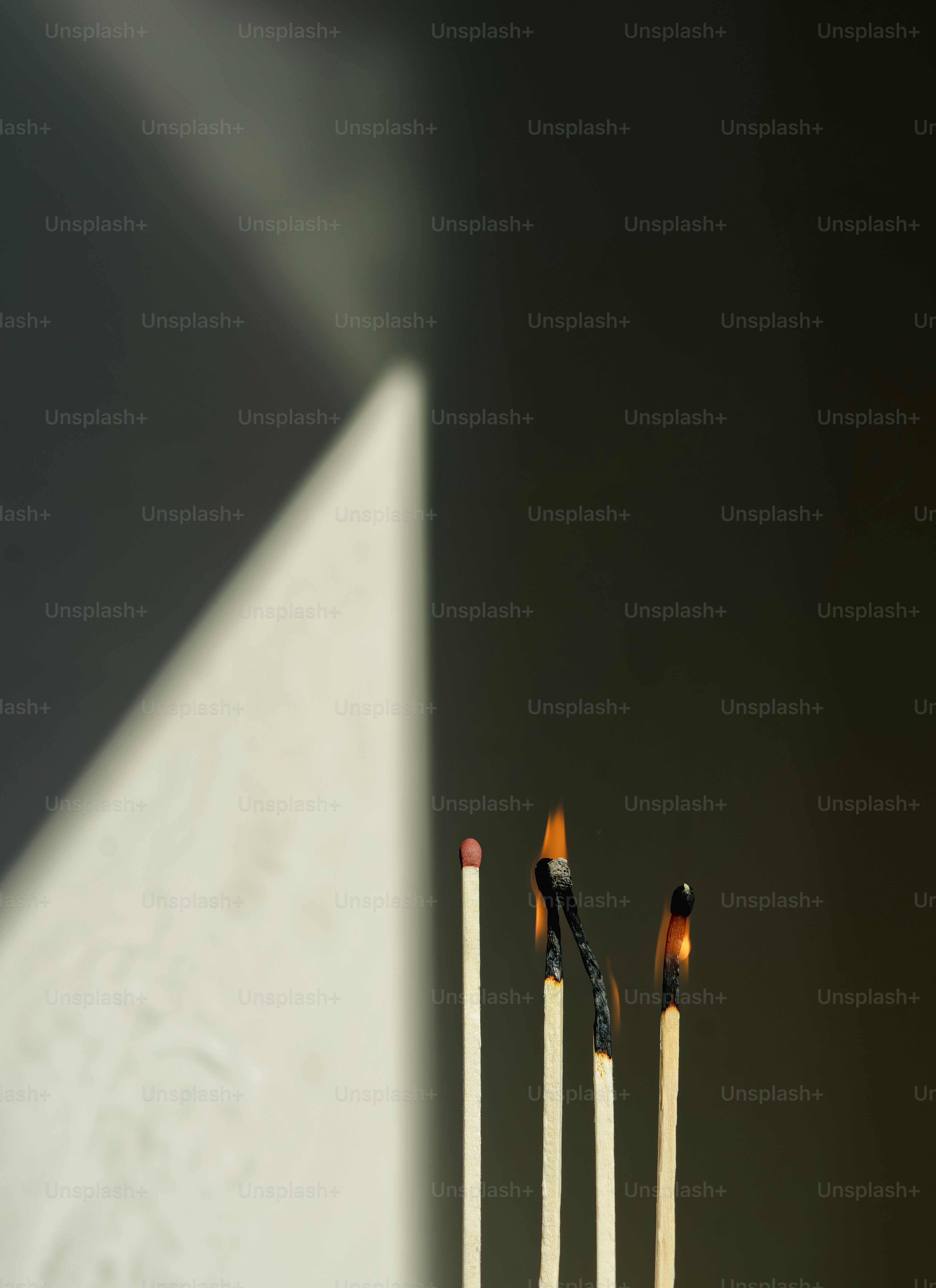 Some matches: one unlit, others burning.