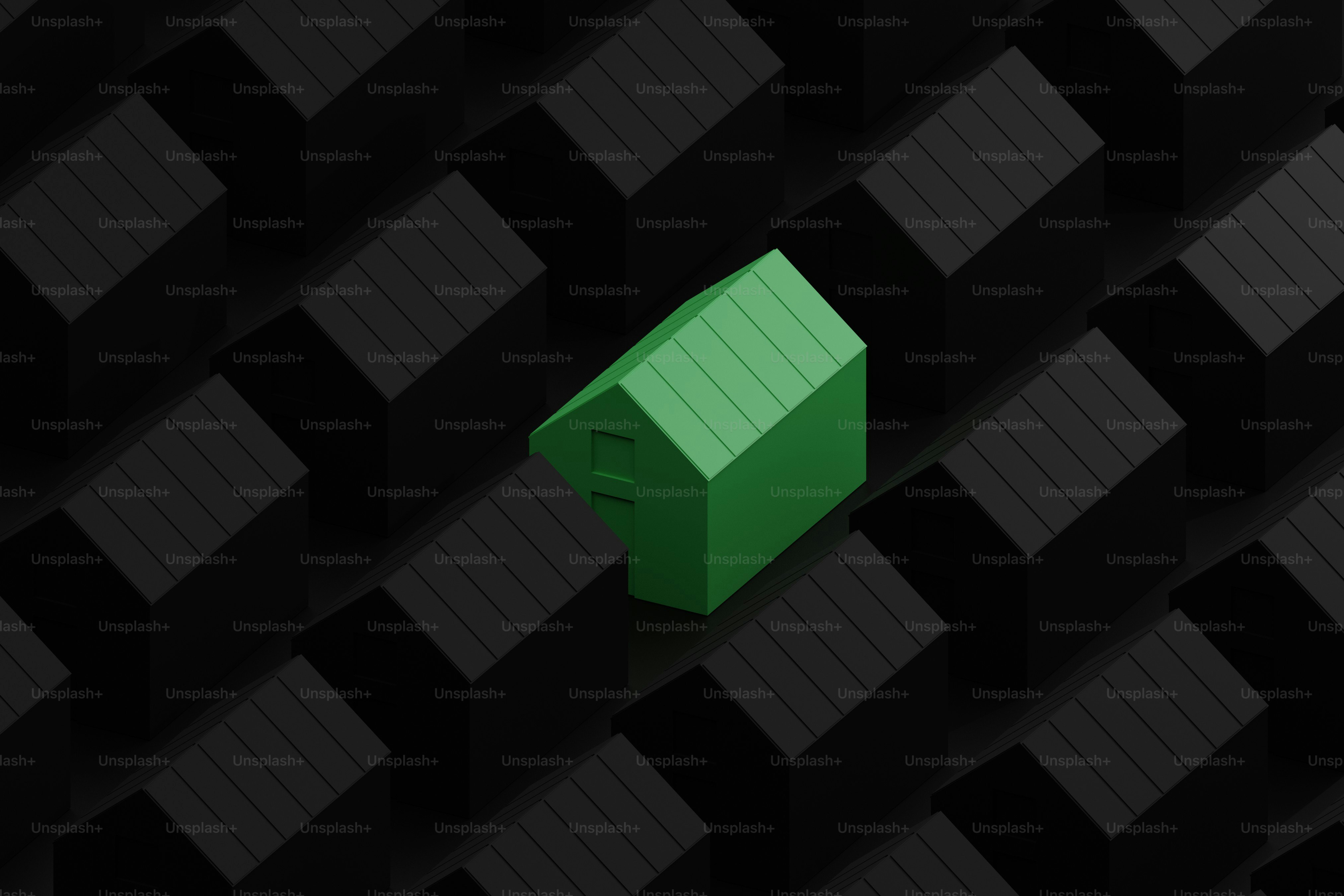 A green house stands out among black ones.