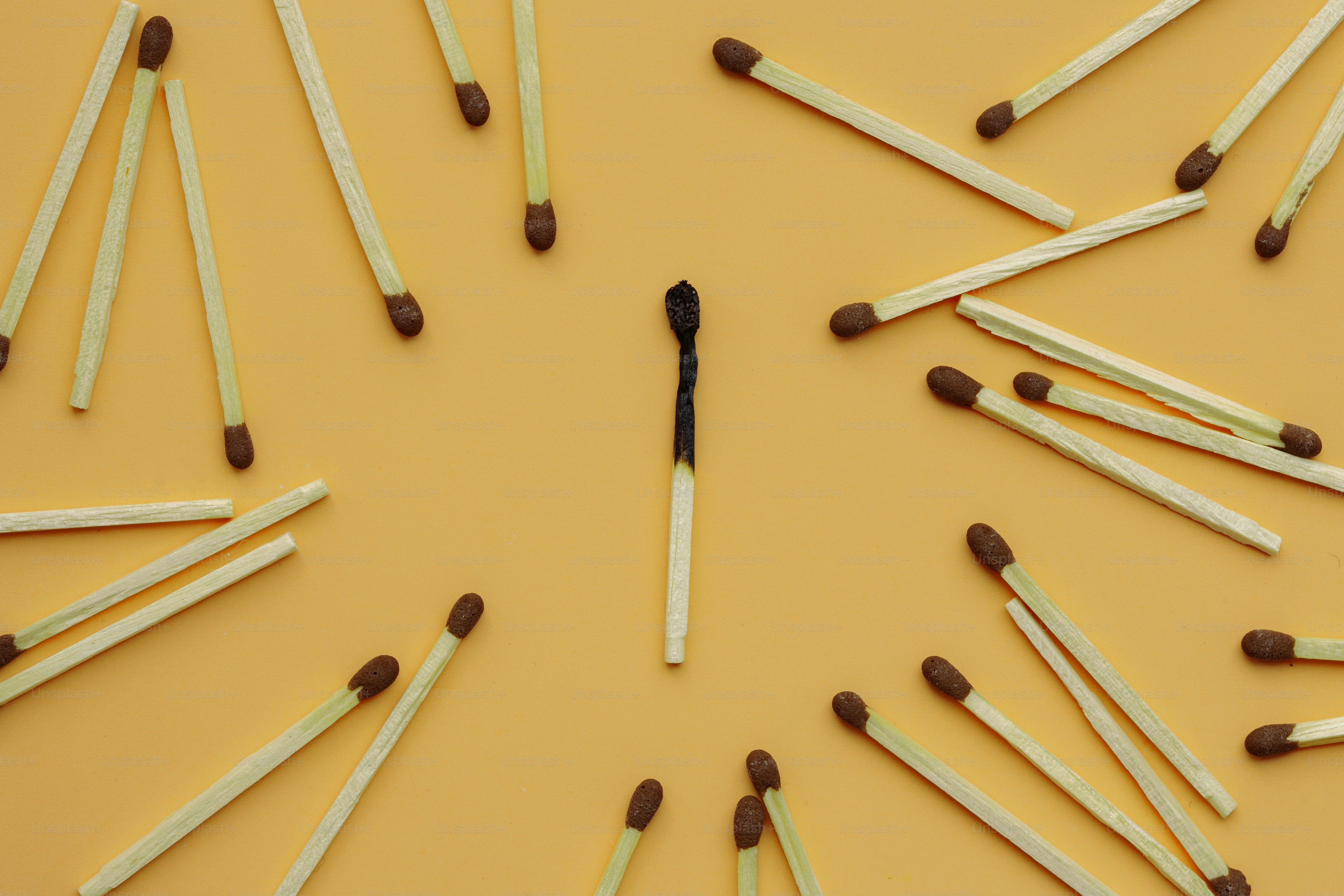 A burnt match surrounded by others.