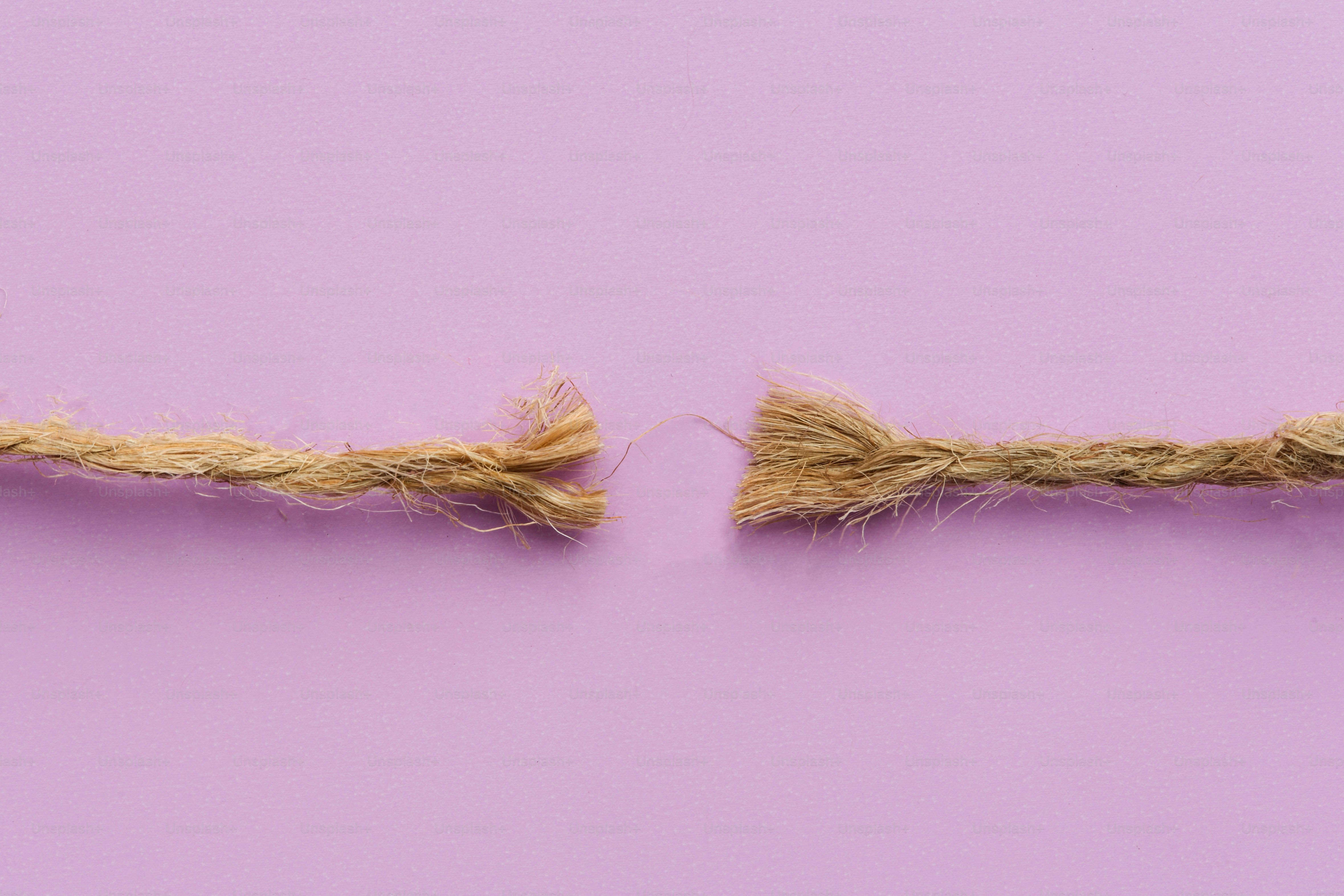 A piece of string is torn in half.