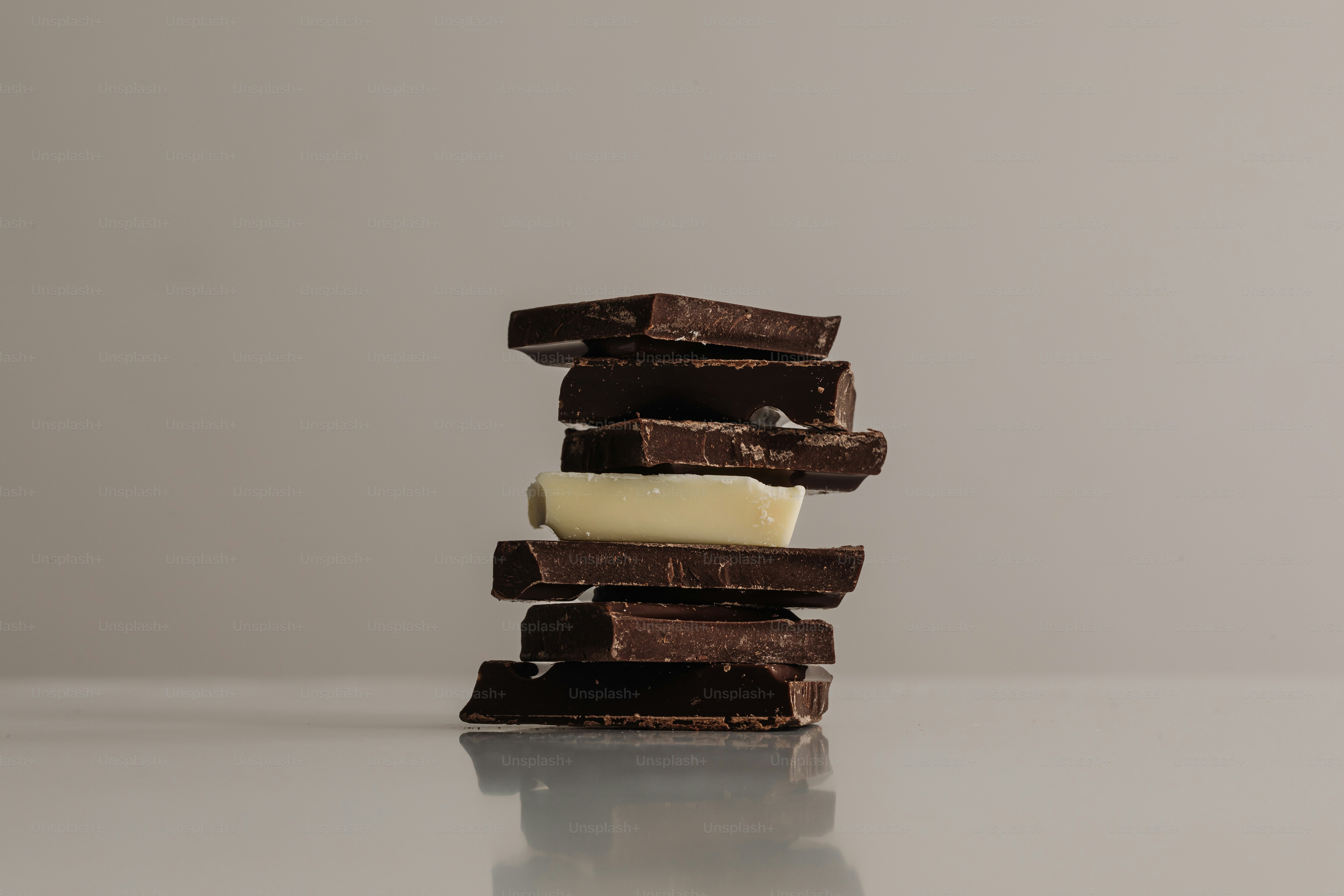 Chocolate bar pieces stacked in a tower.