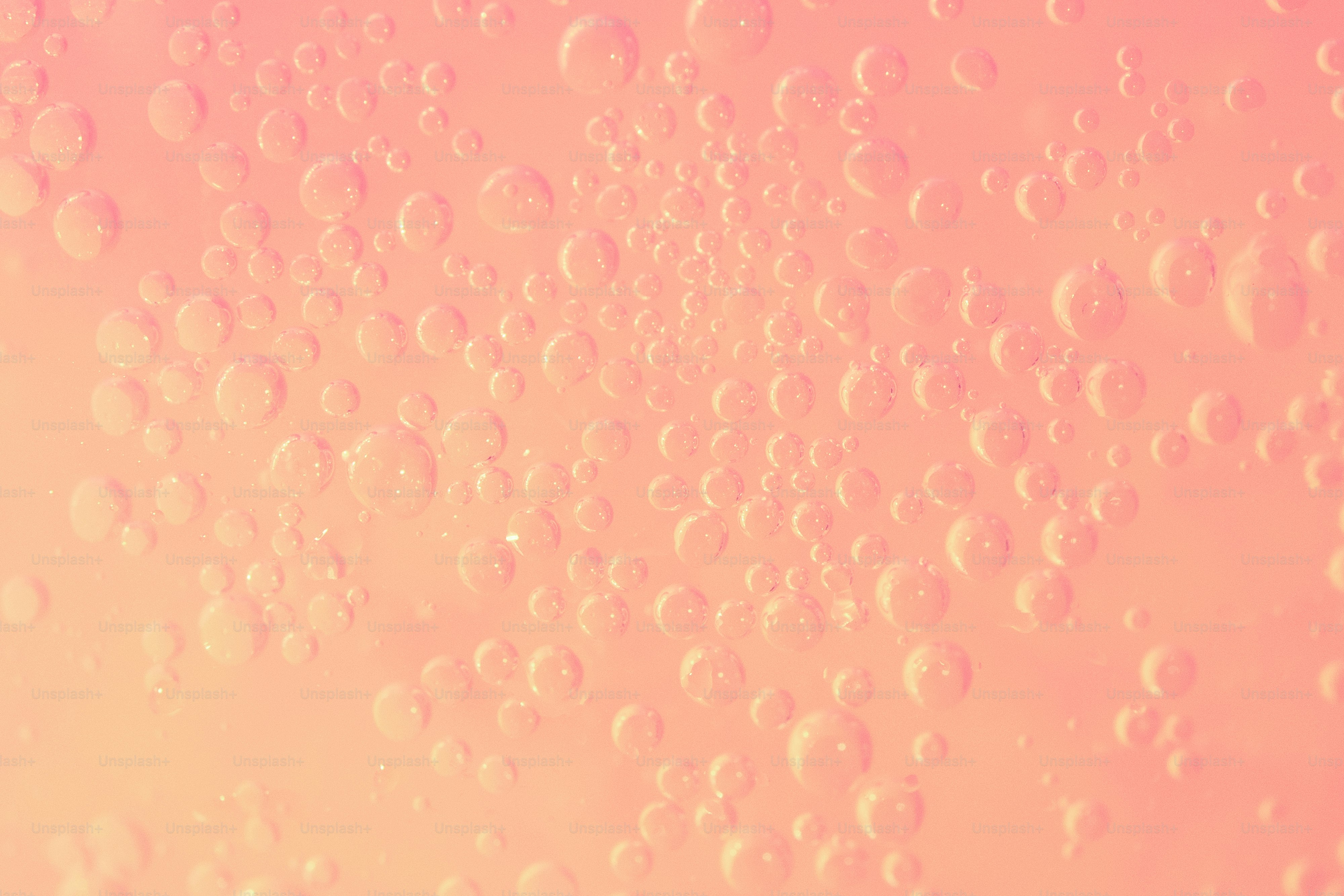Bubbles against a peach-colored backdrop.