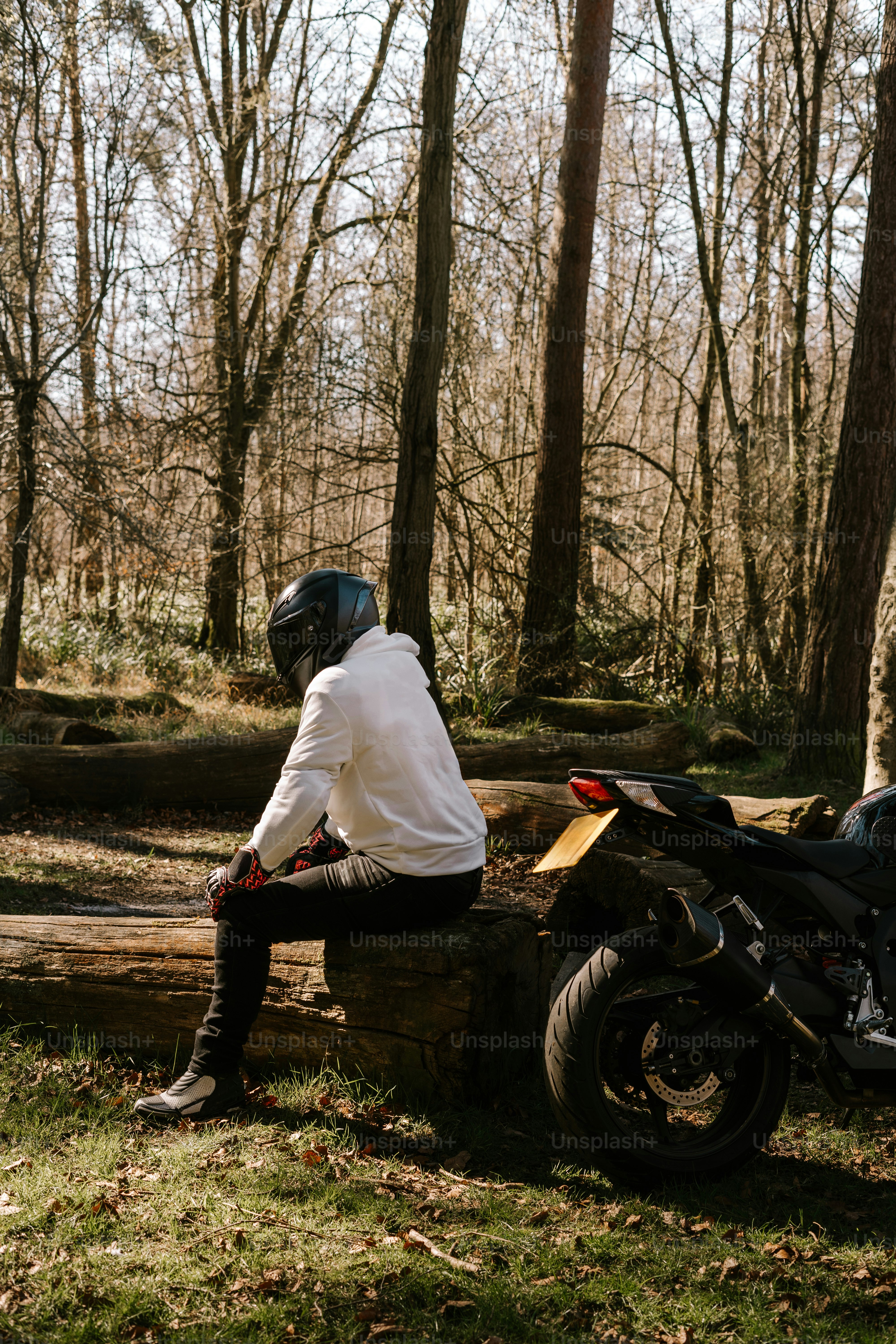 A person is riding a stylish black motorcycle. photo – Motorbike Image ...