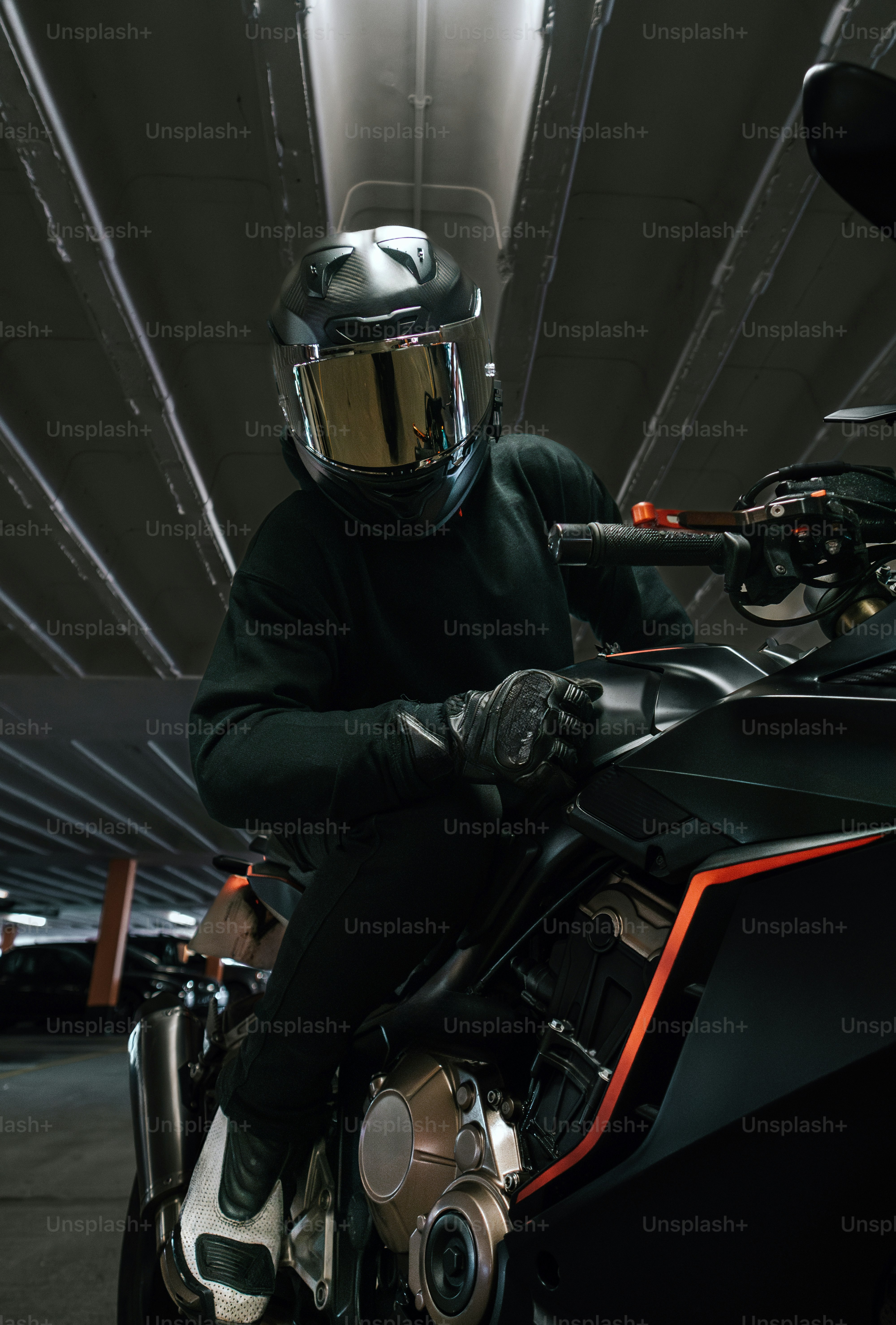 A rider on a black motorcycle poses. photo – Motorbike Image on Unsplash