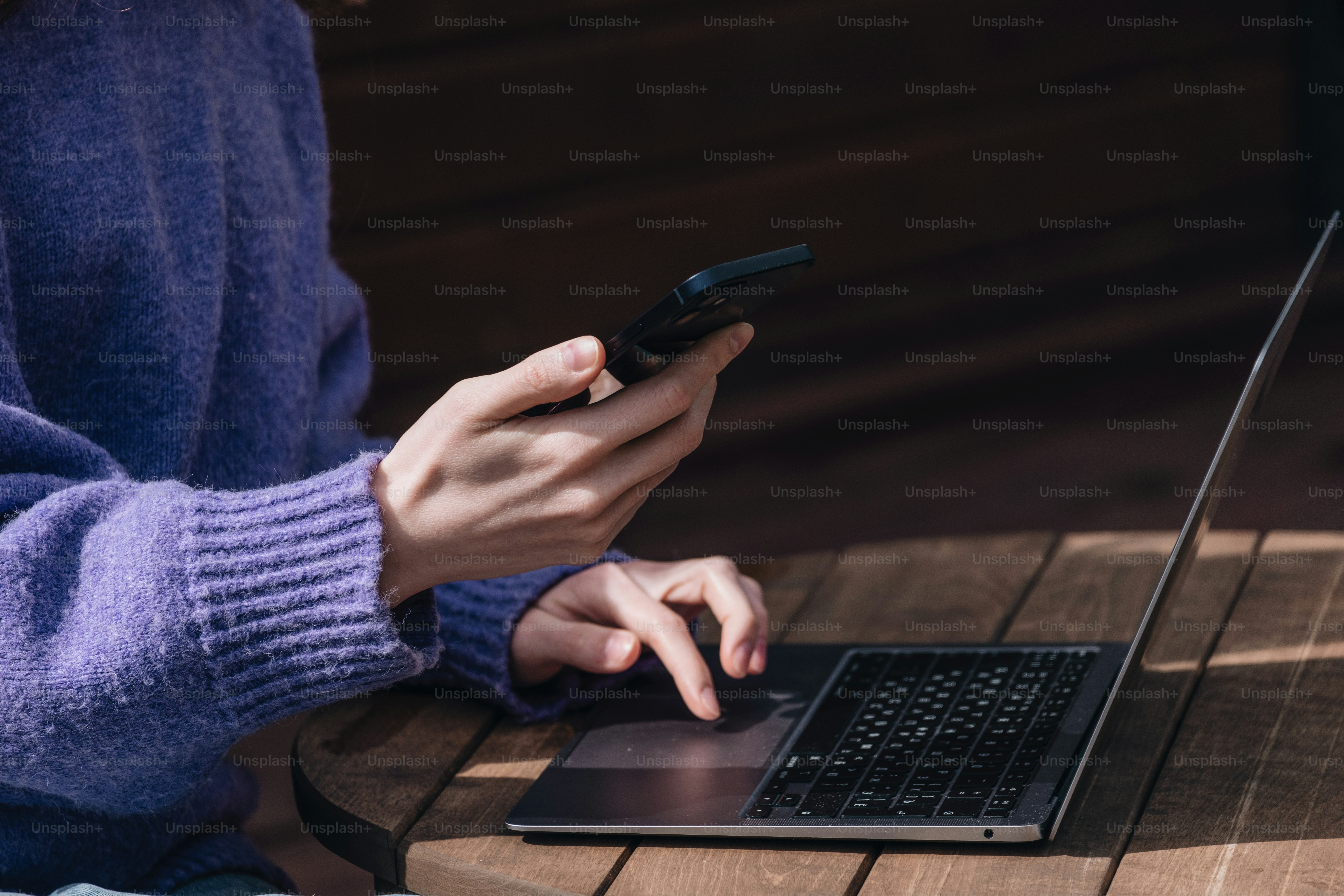 Person uses both a laptop and a mobile phone. photo – Laptop Image on ...