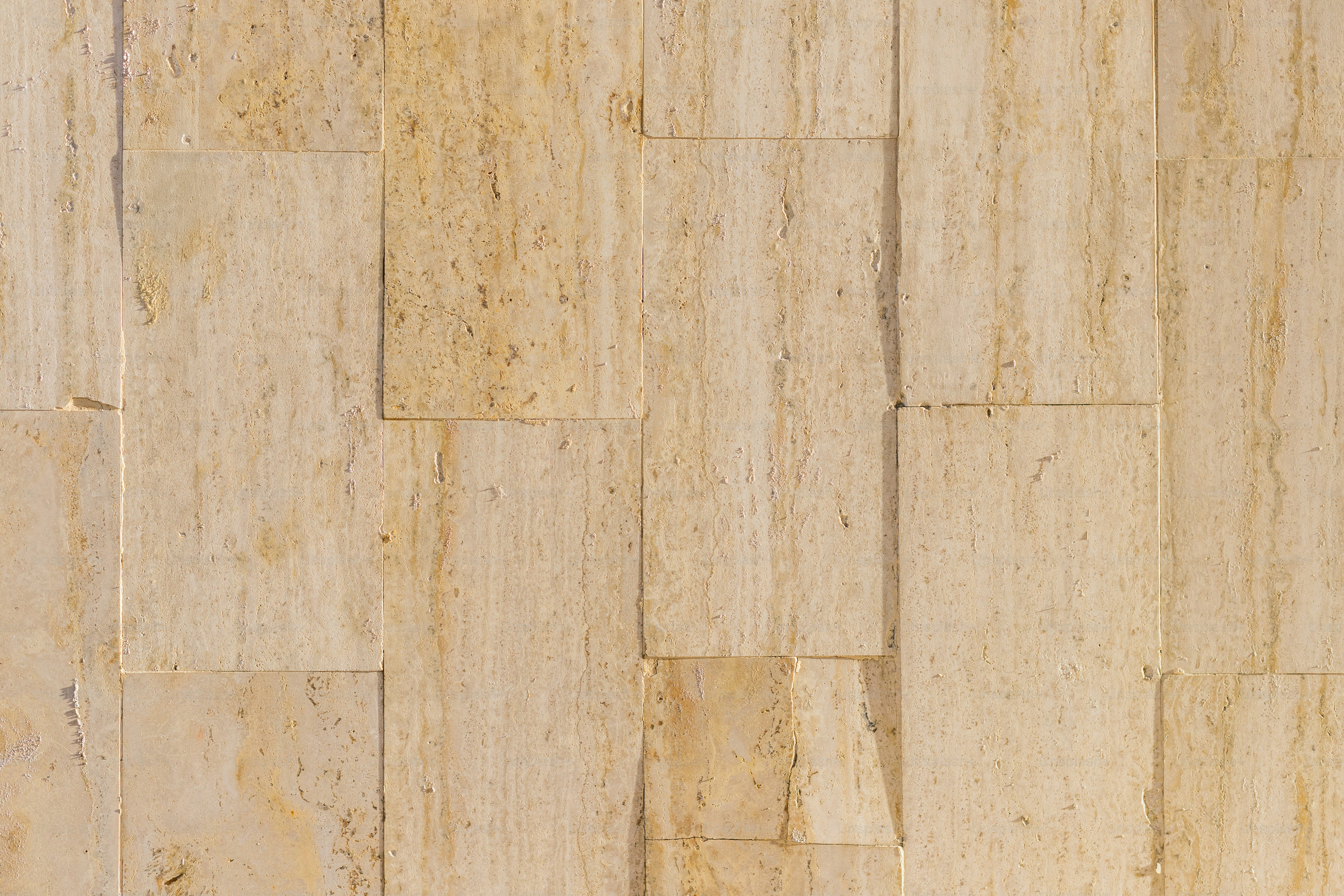 Textured beige tiles create a simple, elegant pattern.