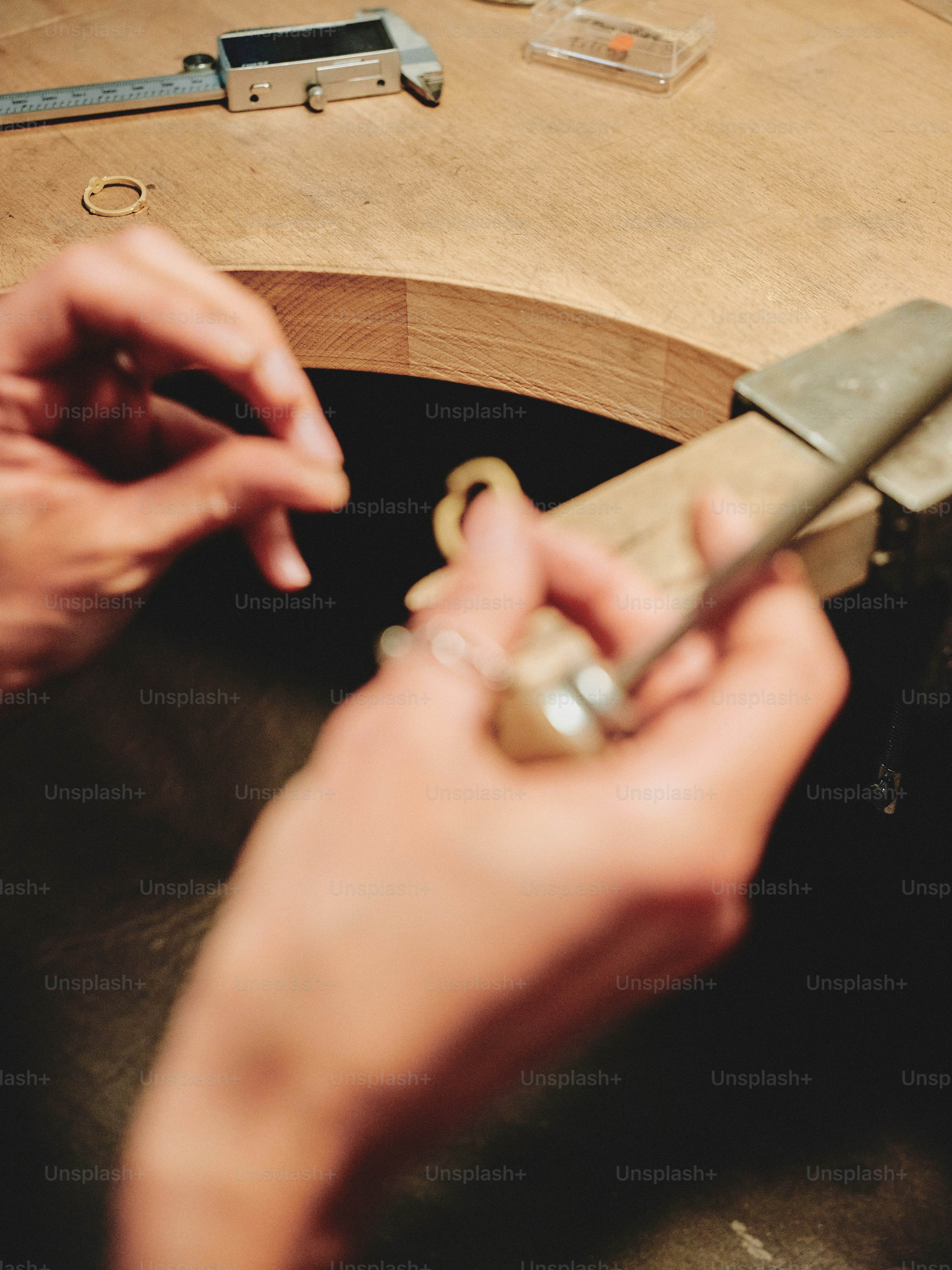 A jeweler working on a piece of jewelry.