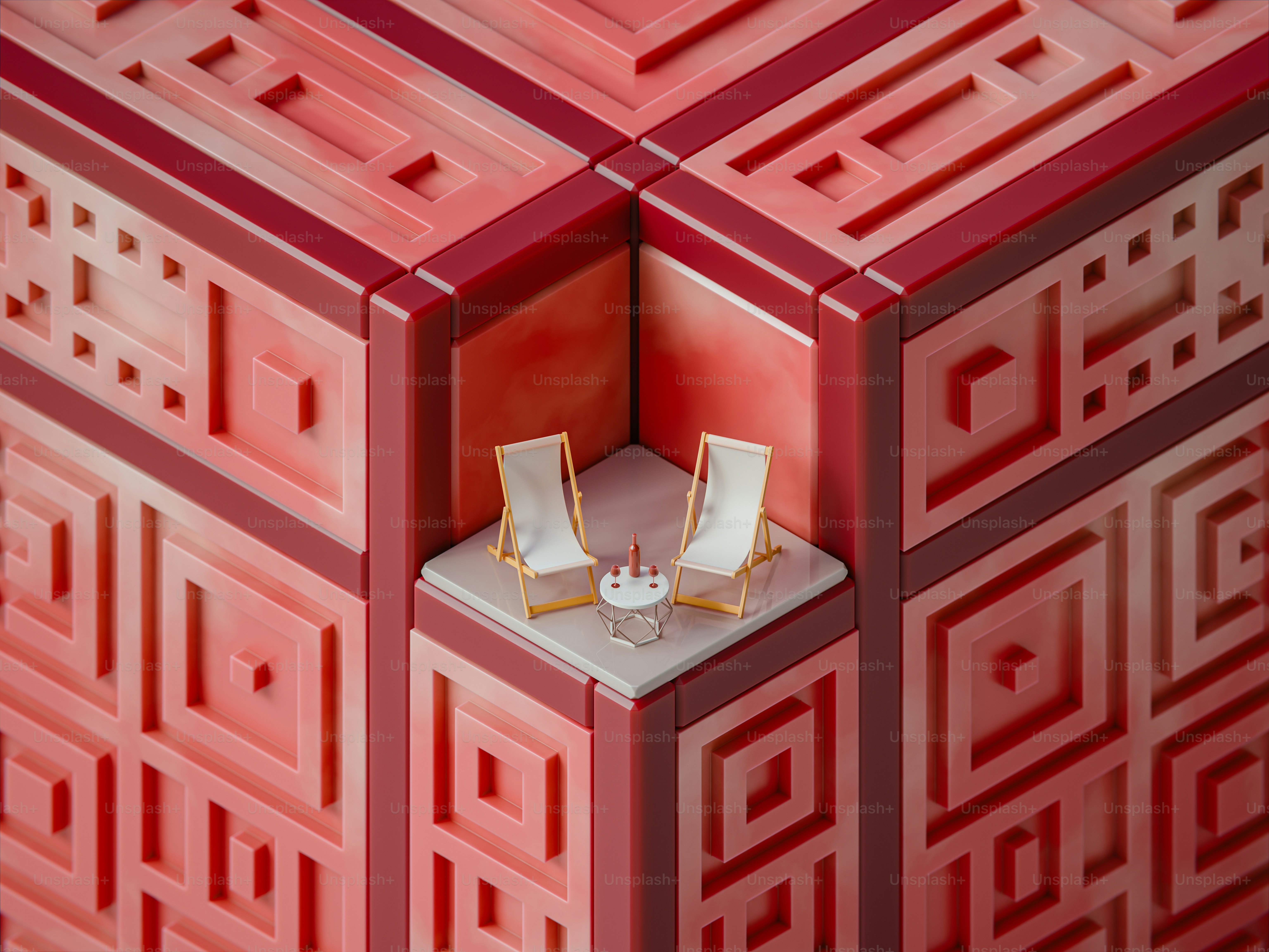 Two chairs rest in a red, geometric alcove.