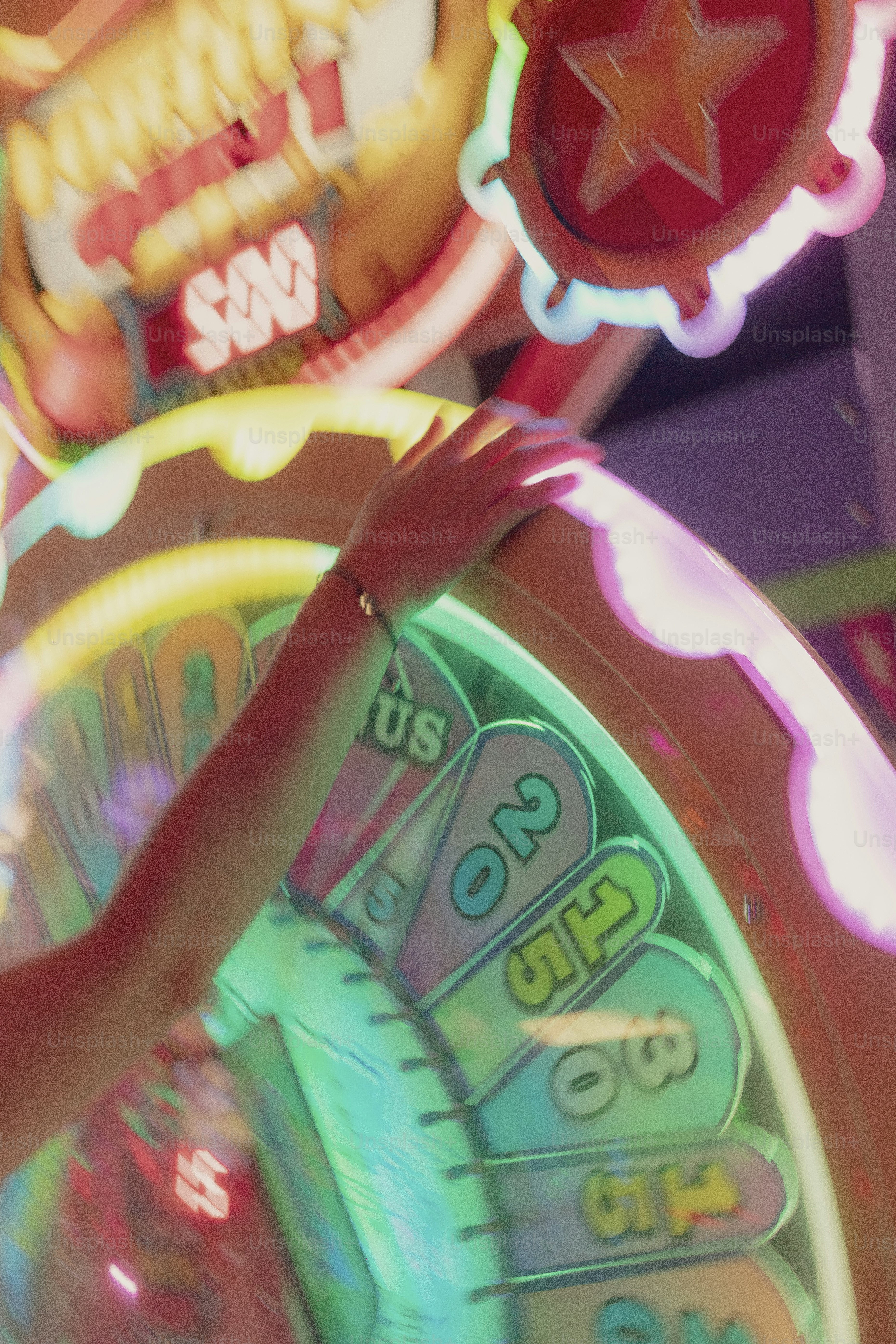 A hand spins a game show wheel.
