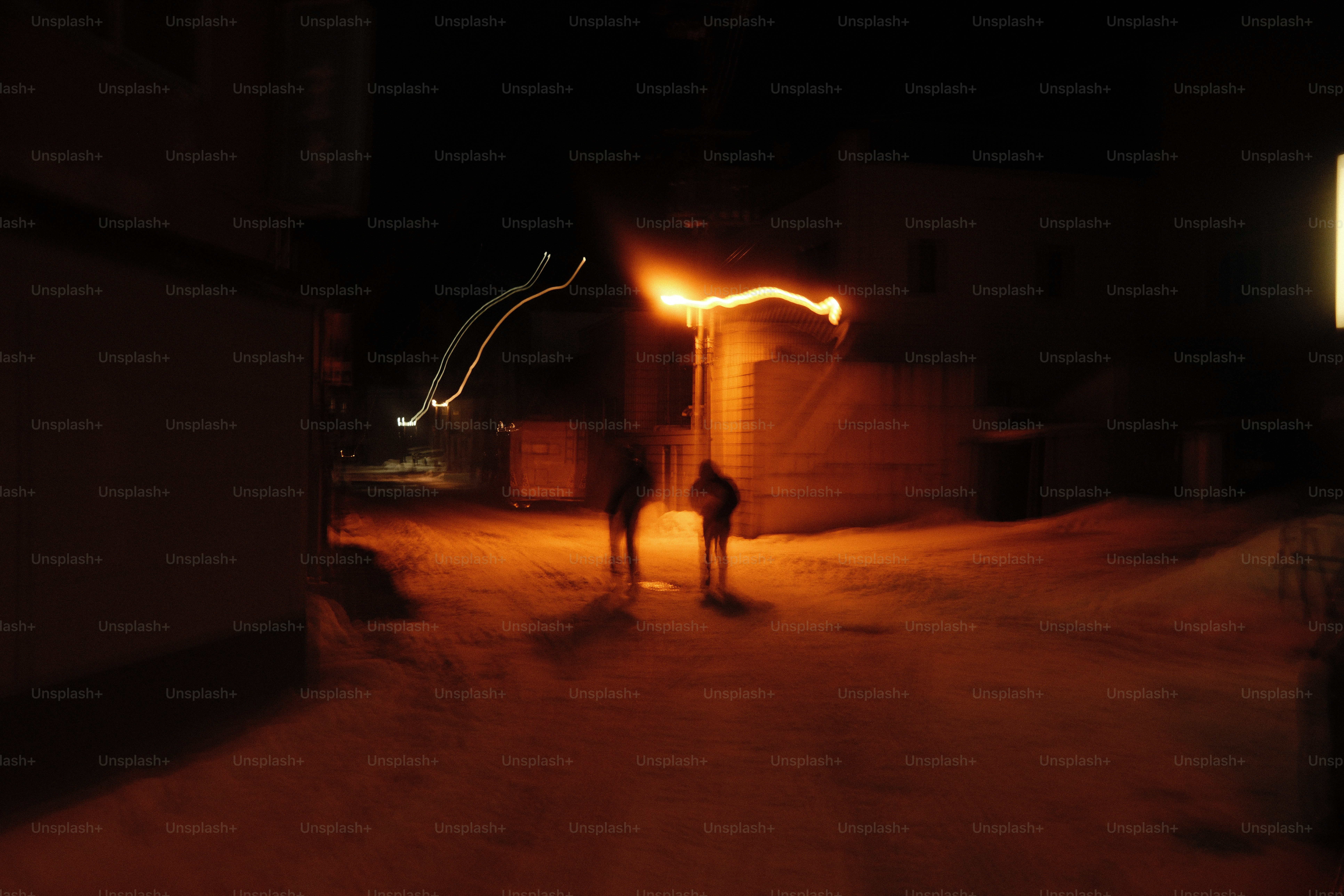Long-exposure shot of people walking at night.