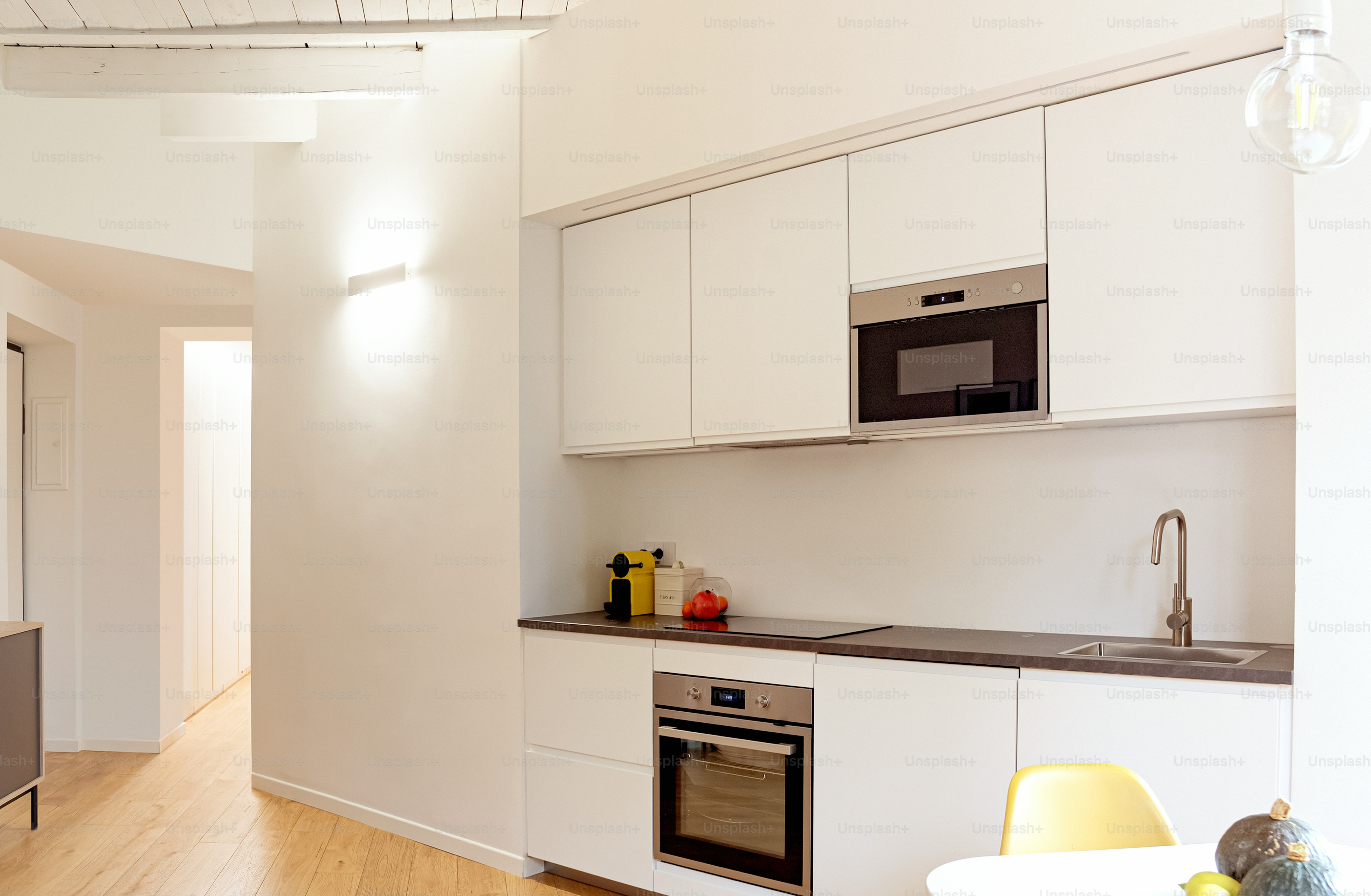 A modern, minimalist kitchen with white cabinets. photo – Interior ...