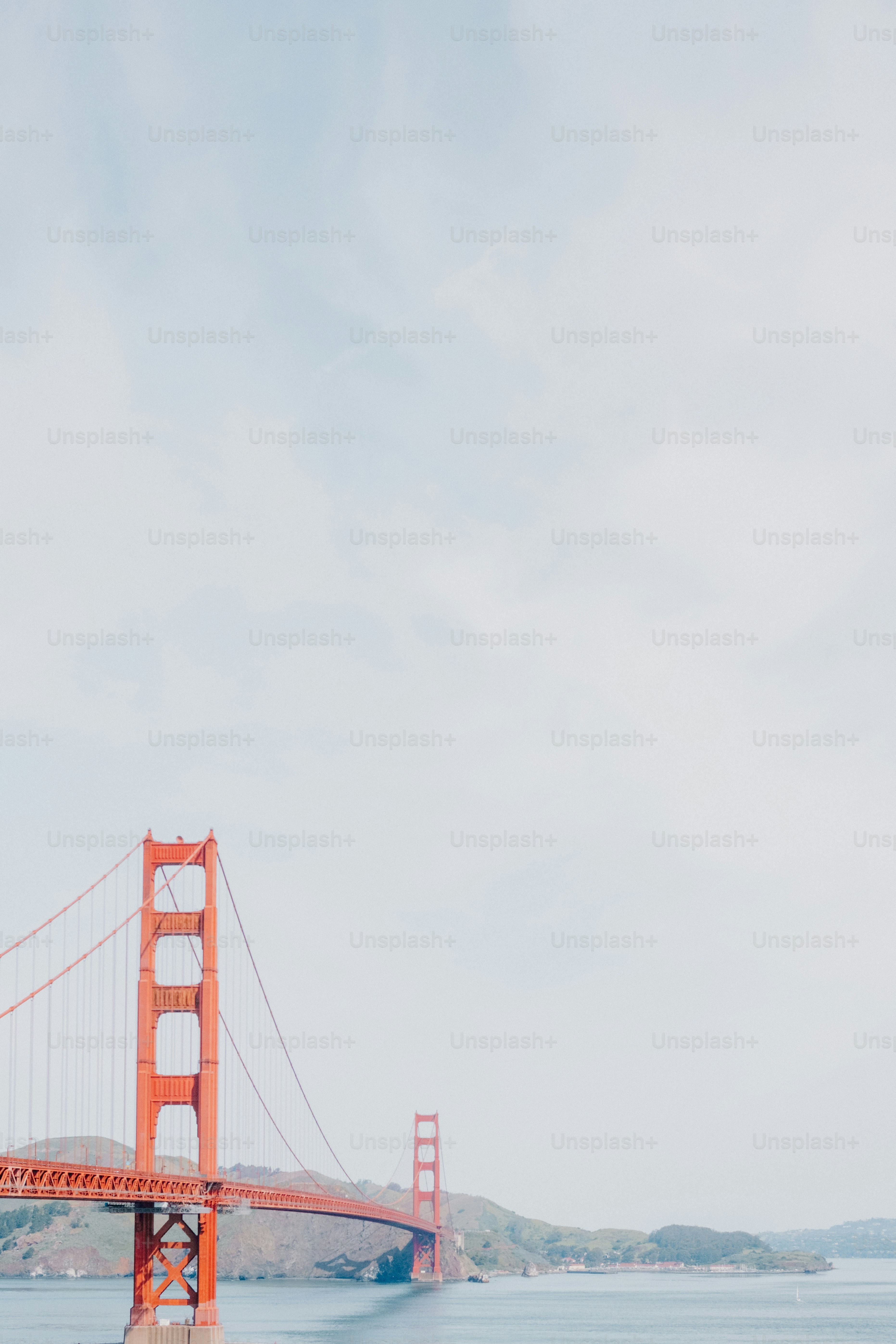 The golden gate bridge spans across the water