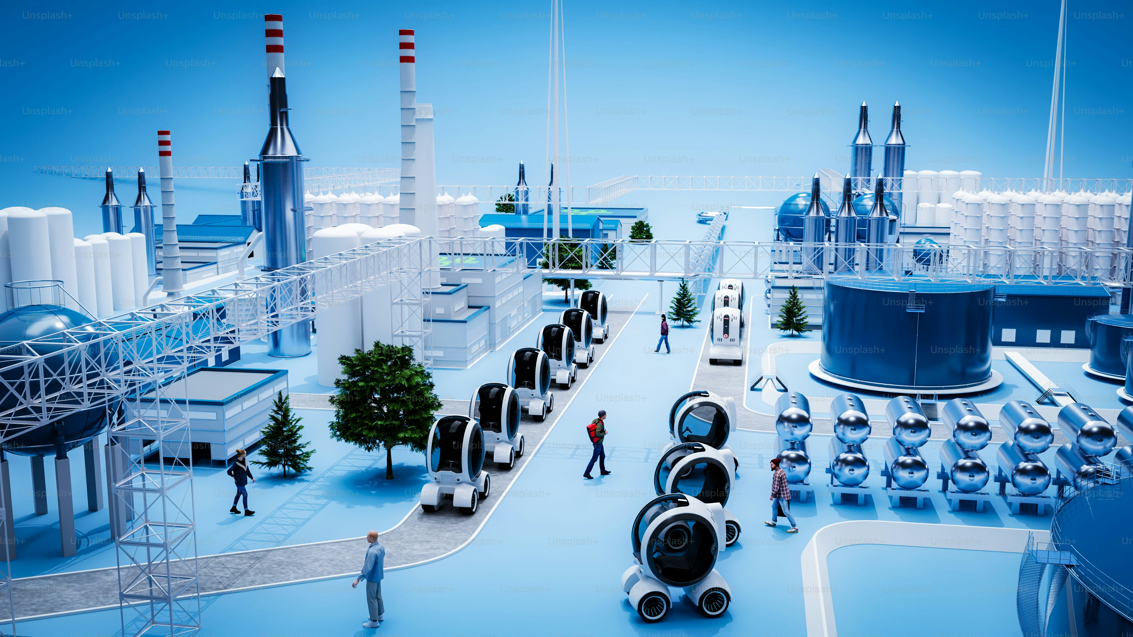 An industrial complex with vehicles and workers is pictured.