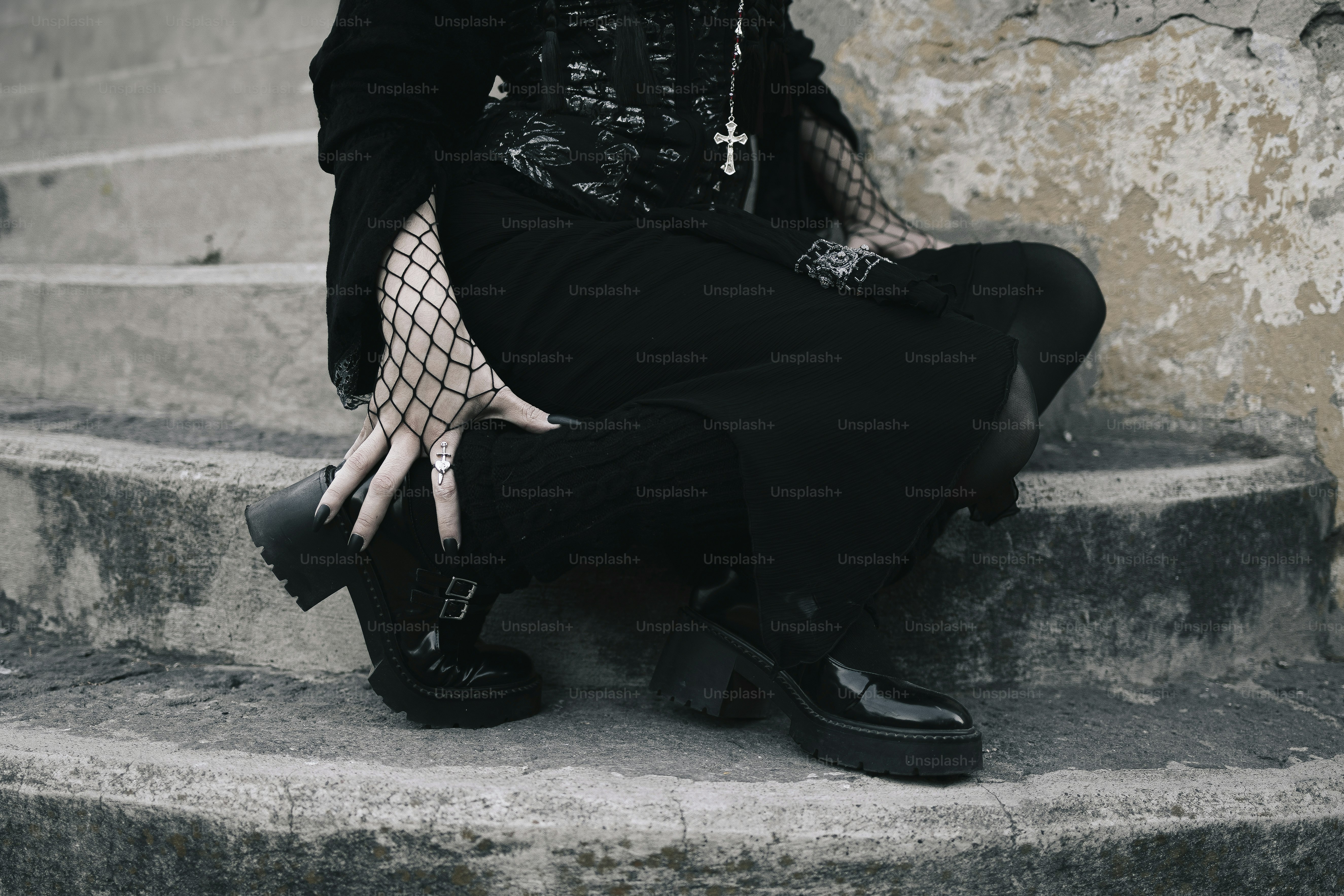 A person dressed in dark, gothic clothing.