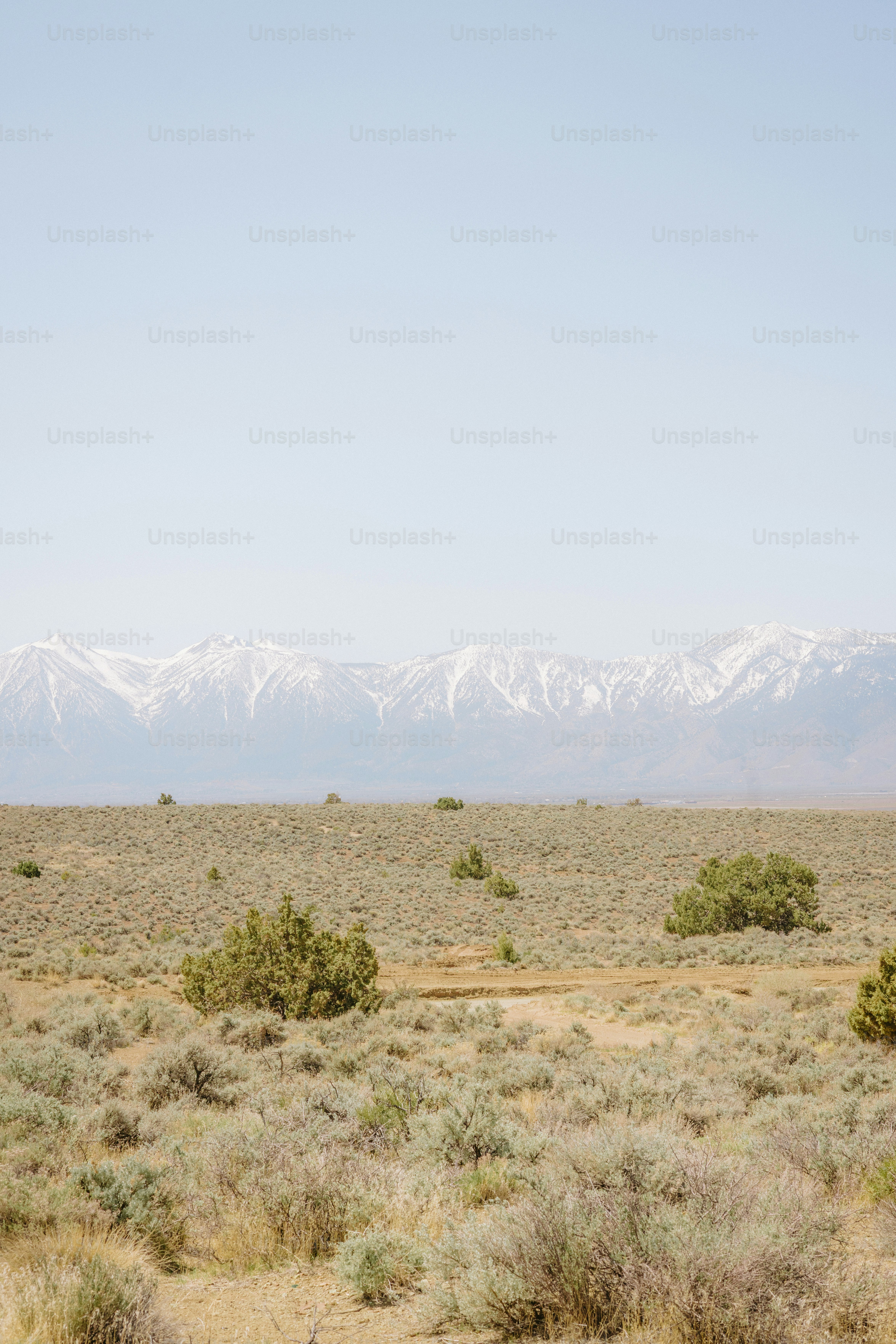 Mountains and desert landscape under a clear sky.