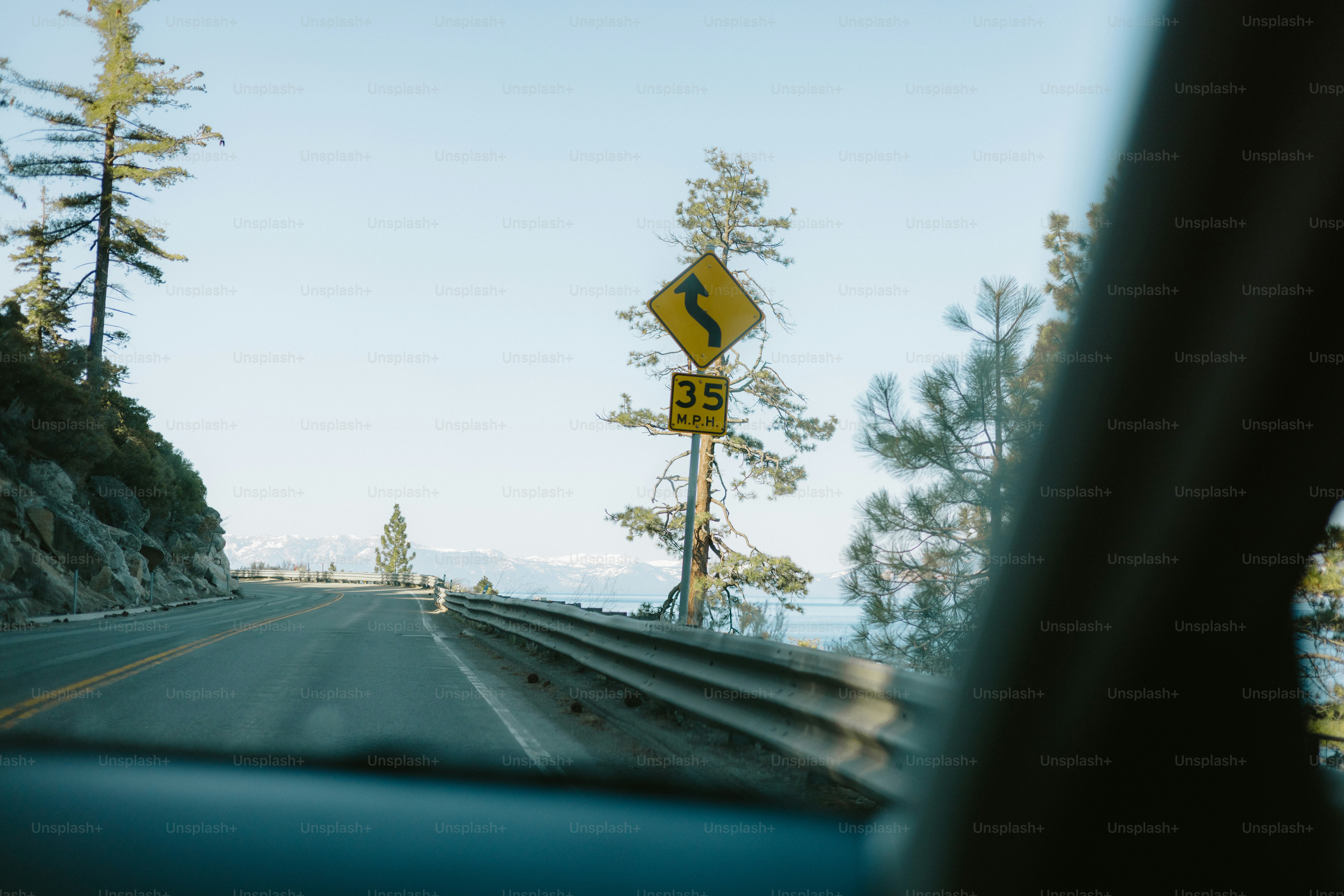 Curved road ahead, drive 35 mph.