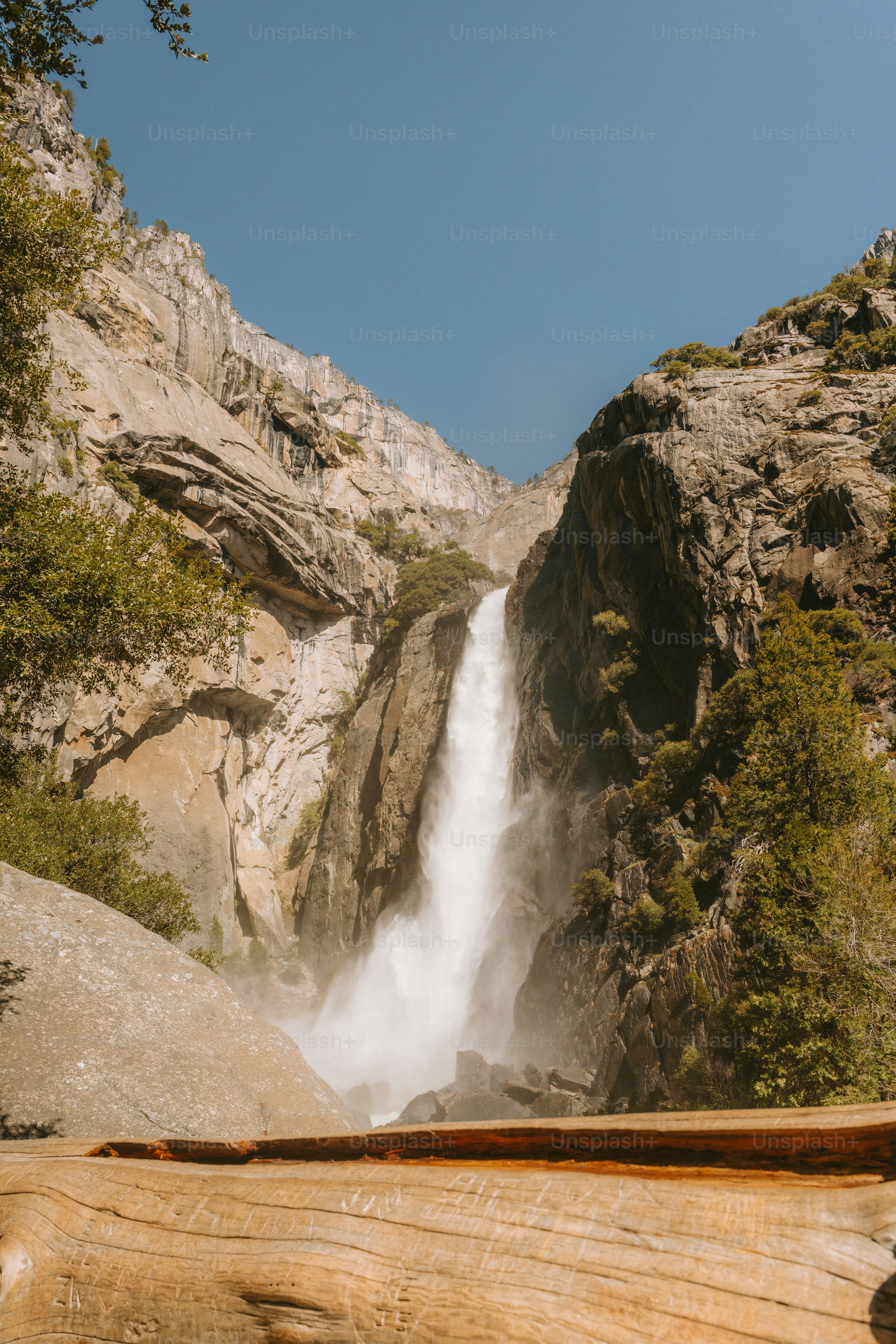 A majestic waterfall cascades down a cliff.
