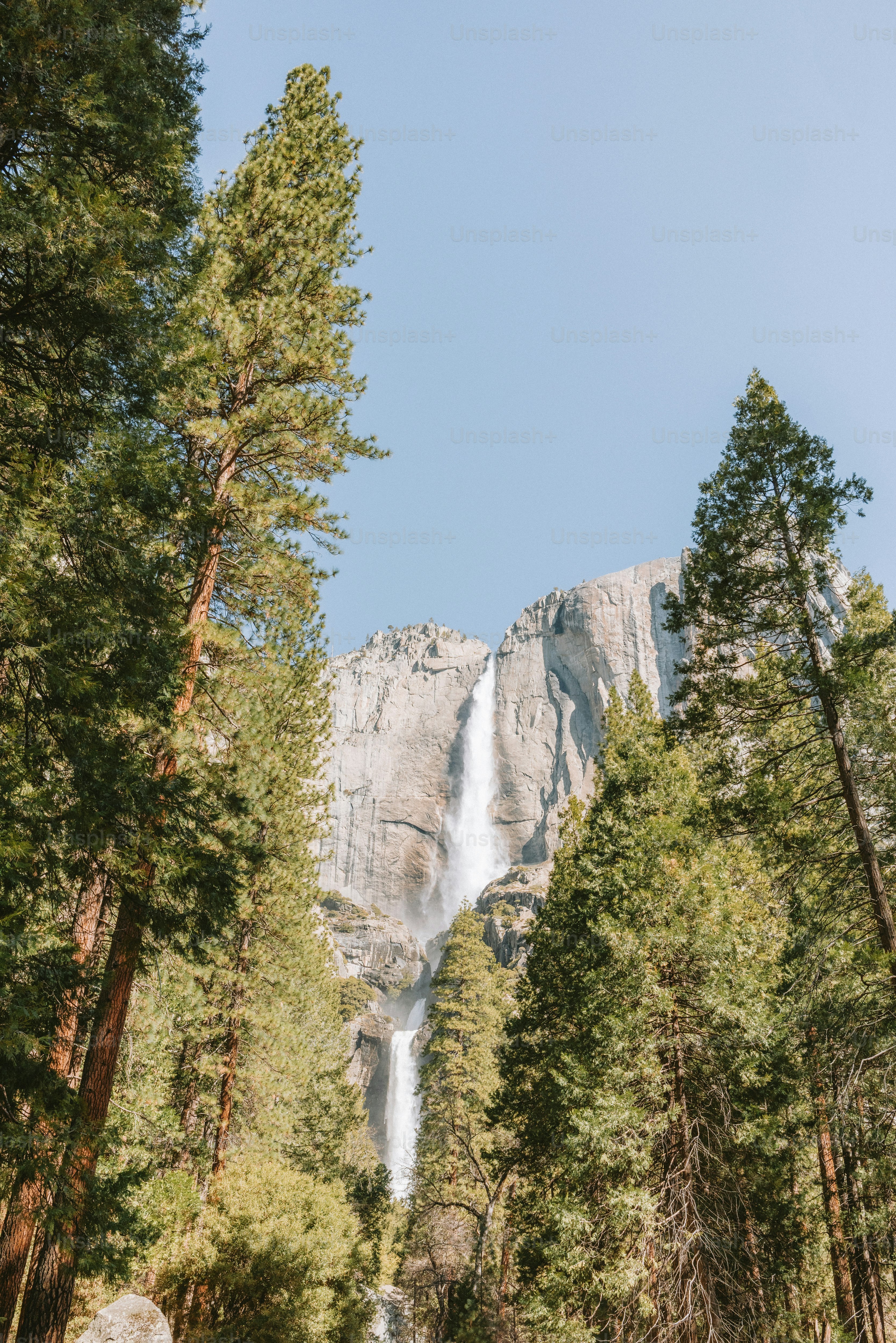 Waterfall cascades down a granite mountain.