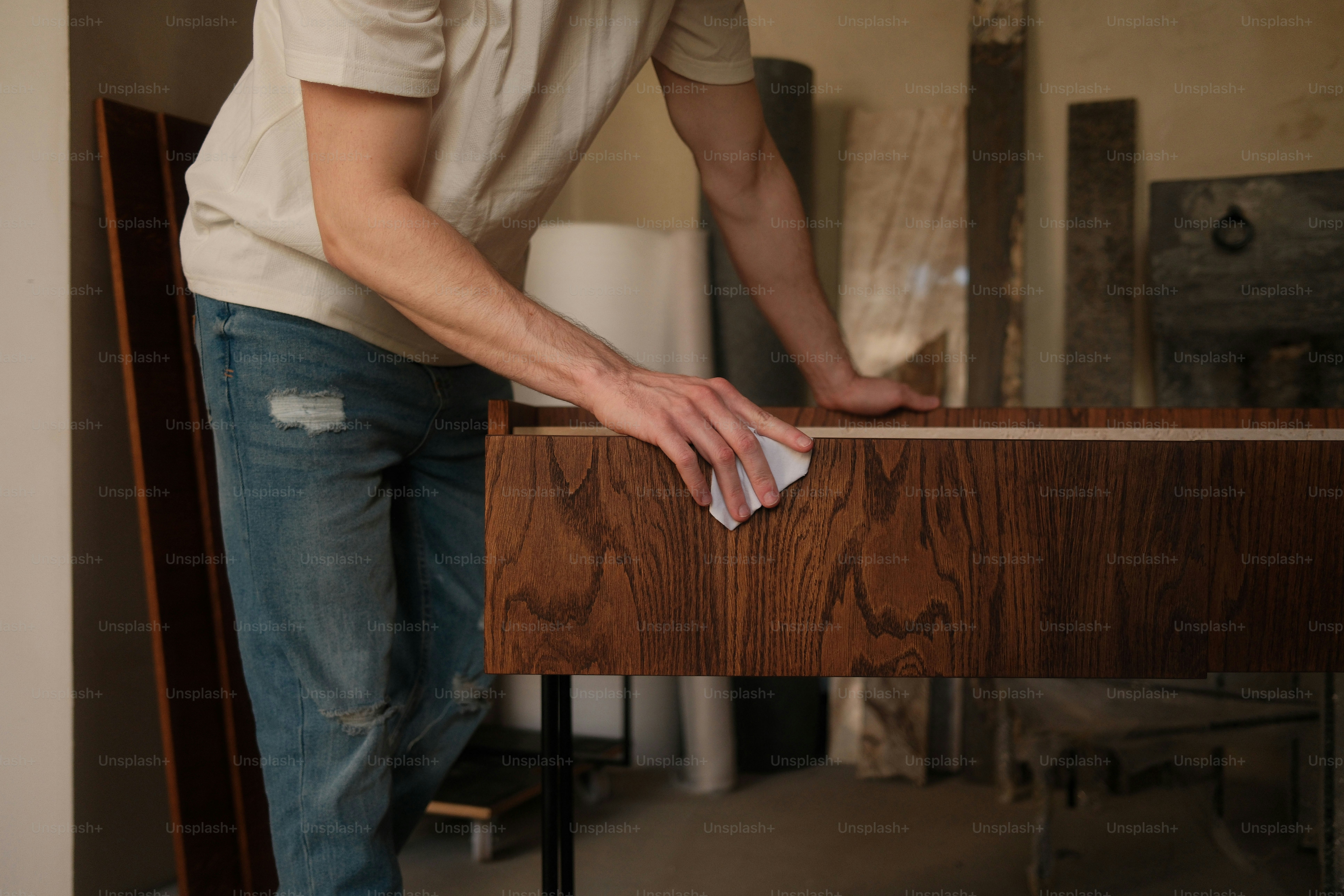 A man is opening a wooden drawer. photo – Luxury Image on Unsplash
