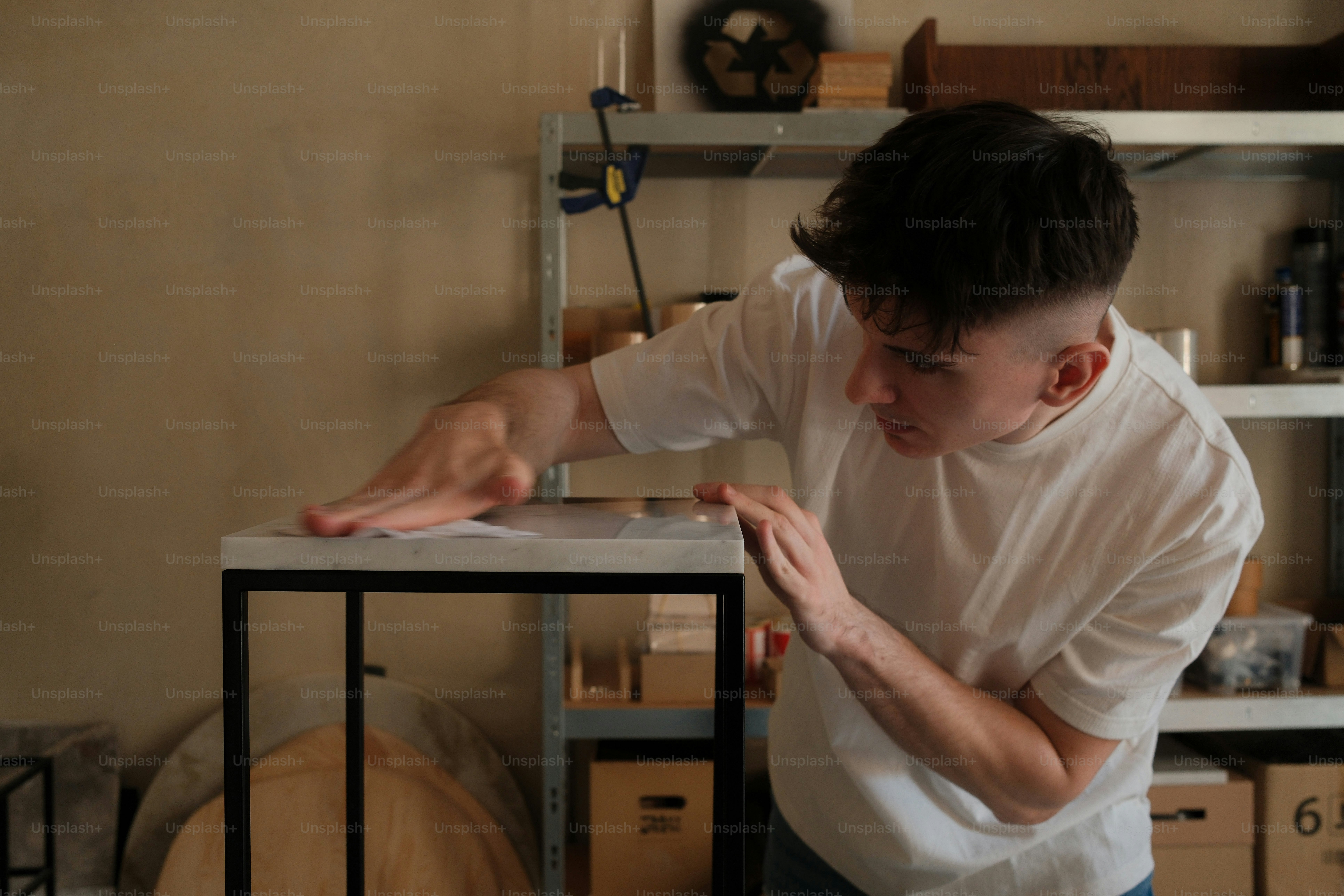 A man is working on a table.