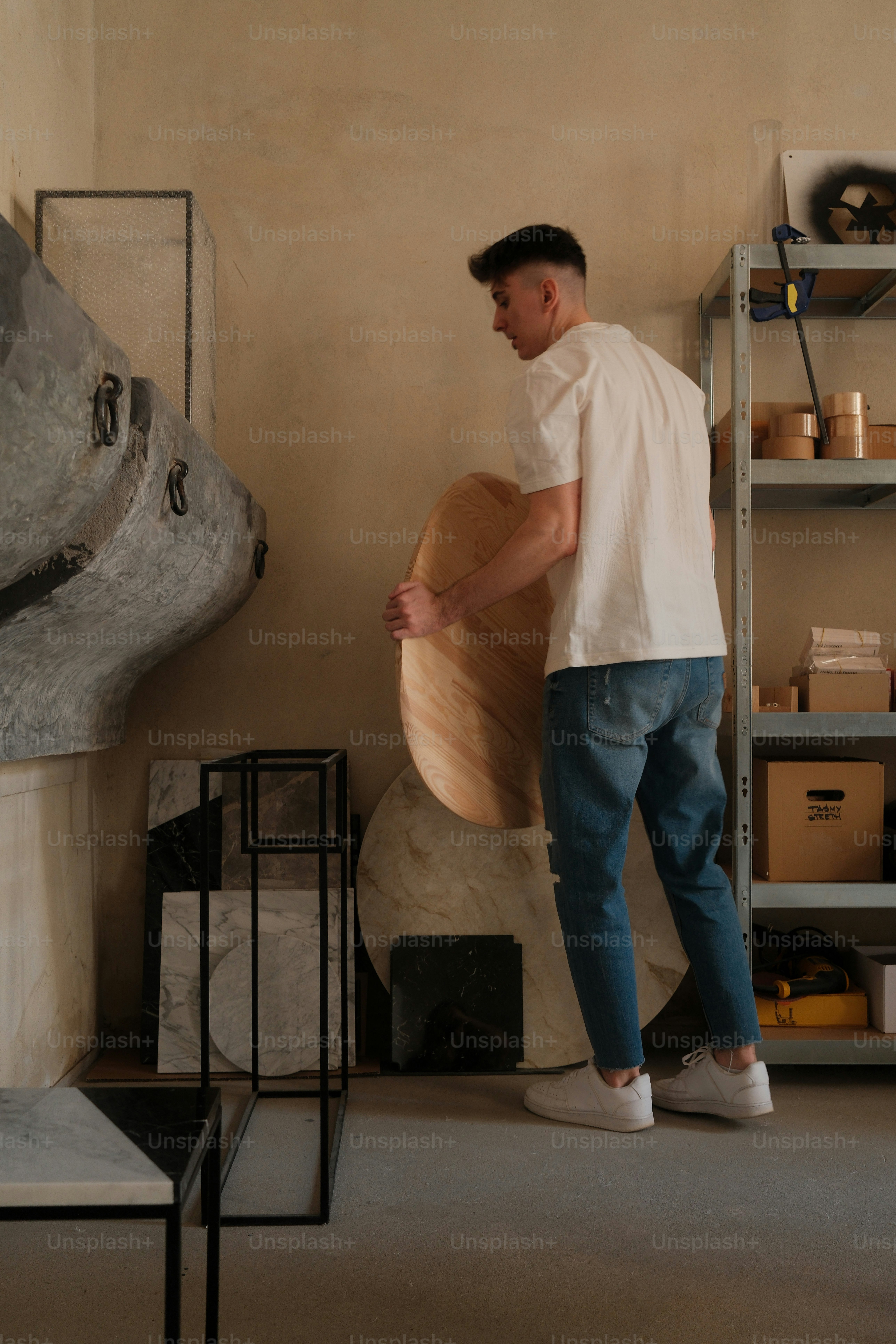 A man is opening a wooden drawer. photo – Luxury Image on Unsplash