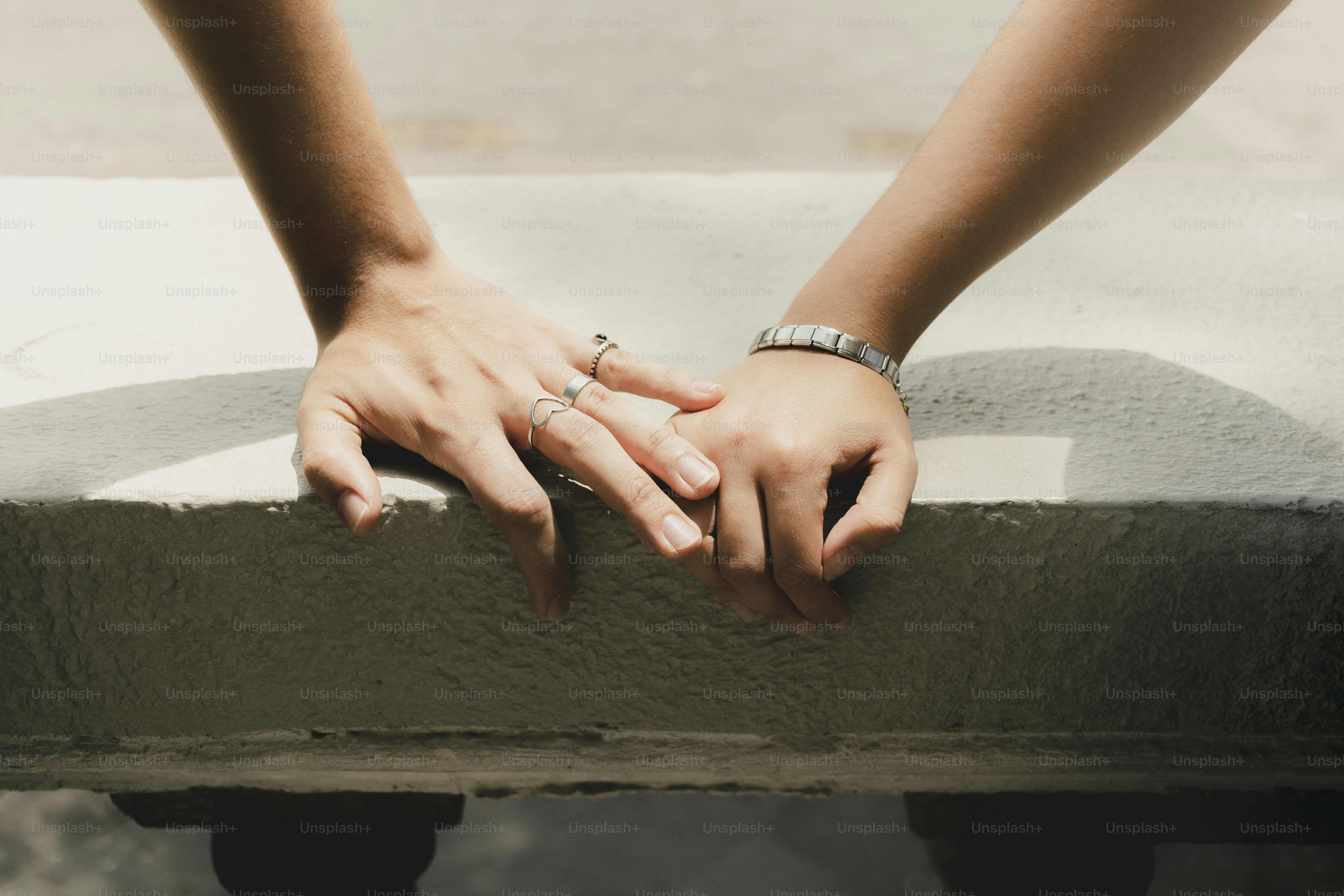 Two hands gently resting together.