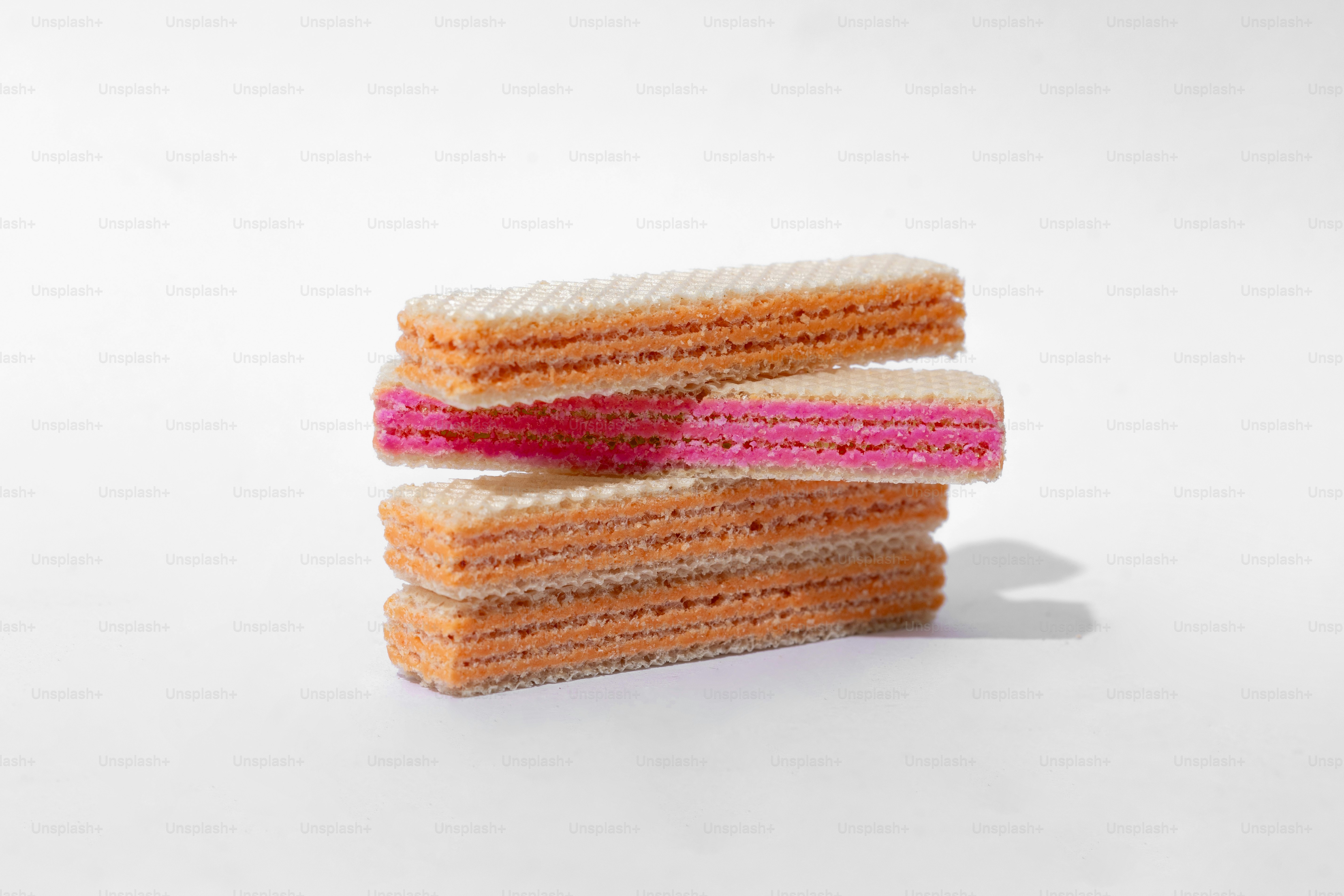 Several colorful wafer cookies are stacked.