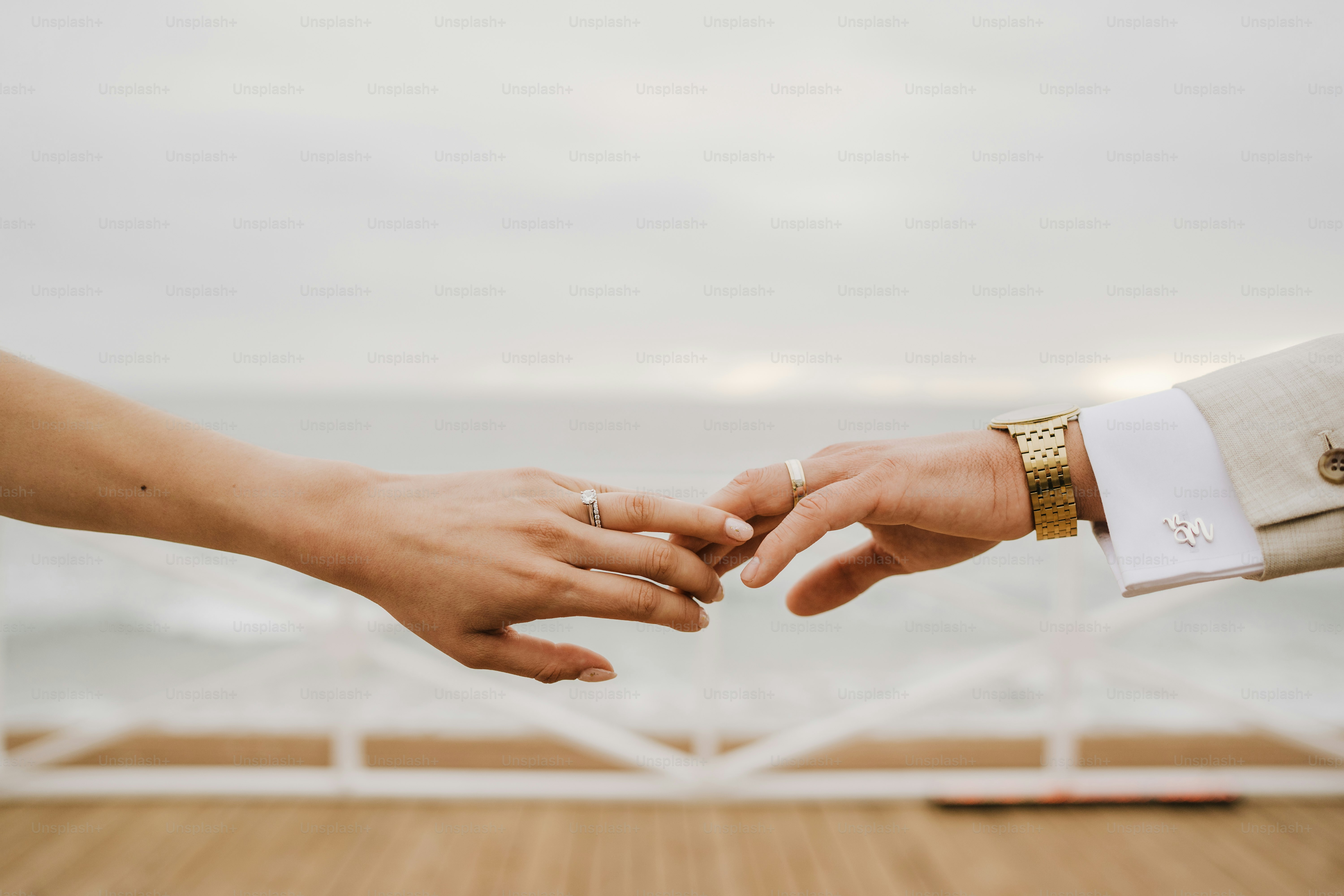 Two hands reach out toward each other.