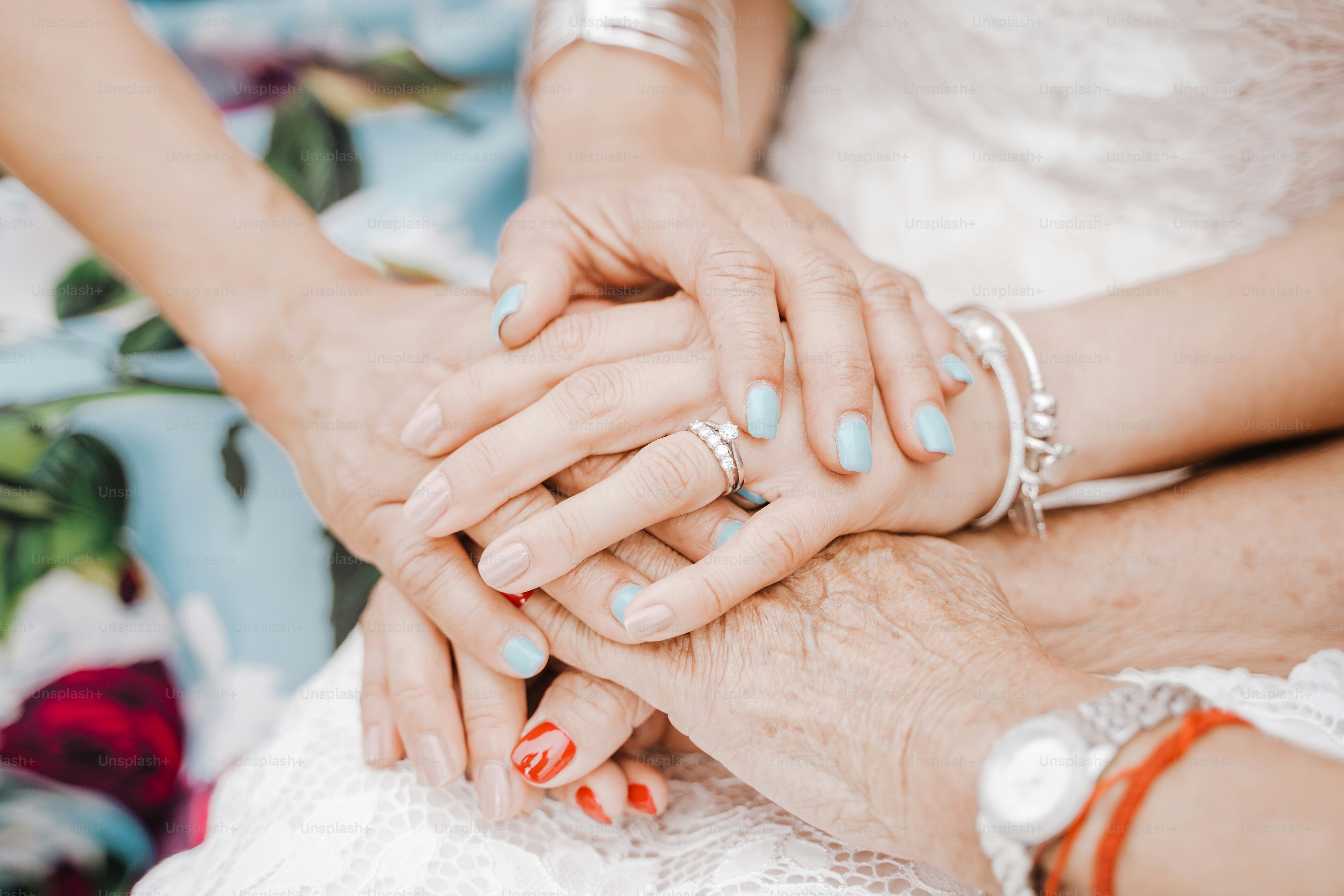 Hands stacked together, showing unity and love.